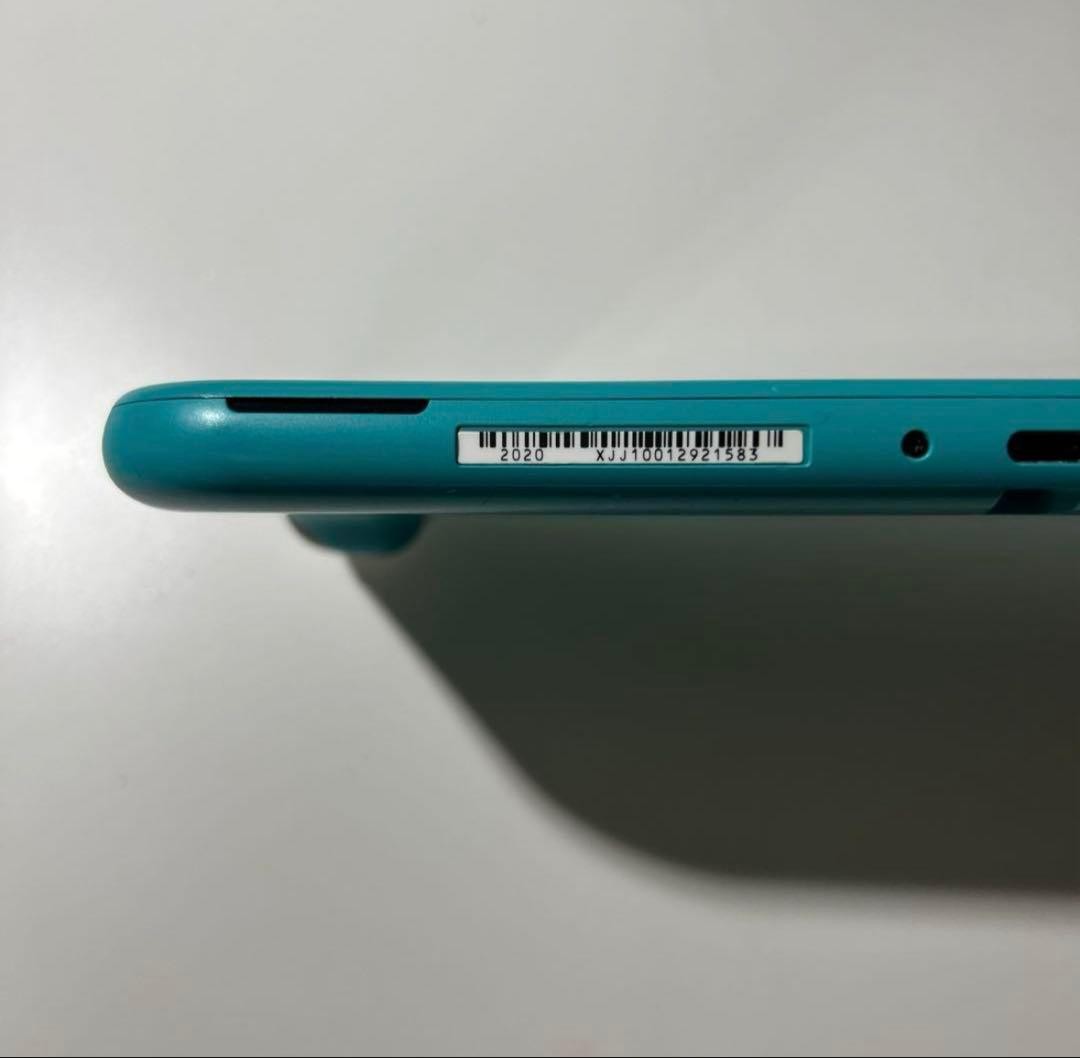 Nintendo Switch Lite Turquoise console with charger light blue