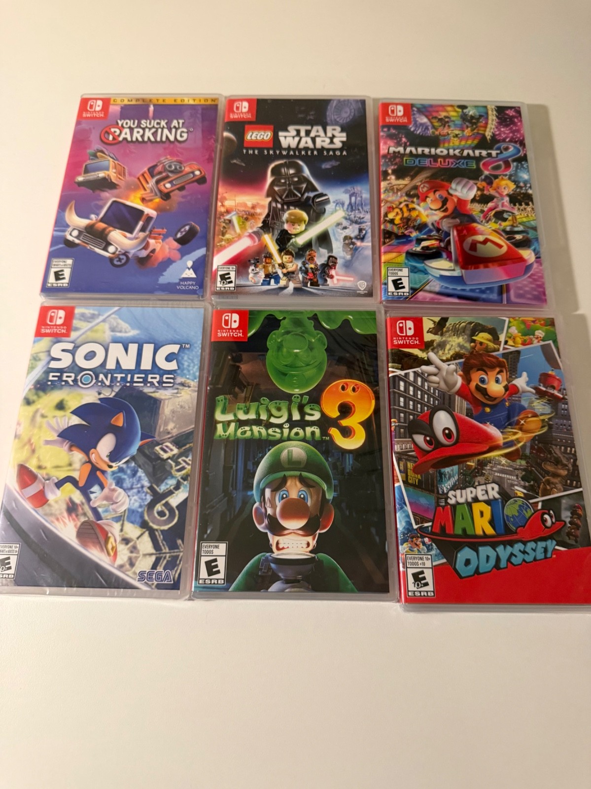 Nintendo Switch OLED Console + 6 Games + Extra Controllers (Some Games Unopened)