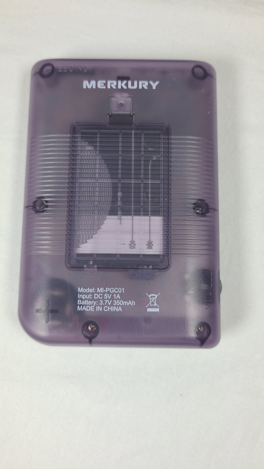 Merkury Innovations Arcade Fun Portable Game Console in a transparent purple…