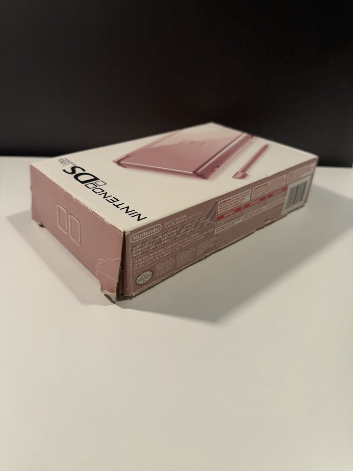 Nintendo DS Lite Metallic Rose System With Charger, Original Box, And 2 Cases