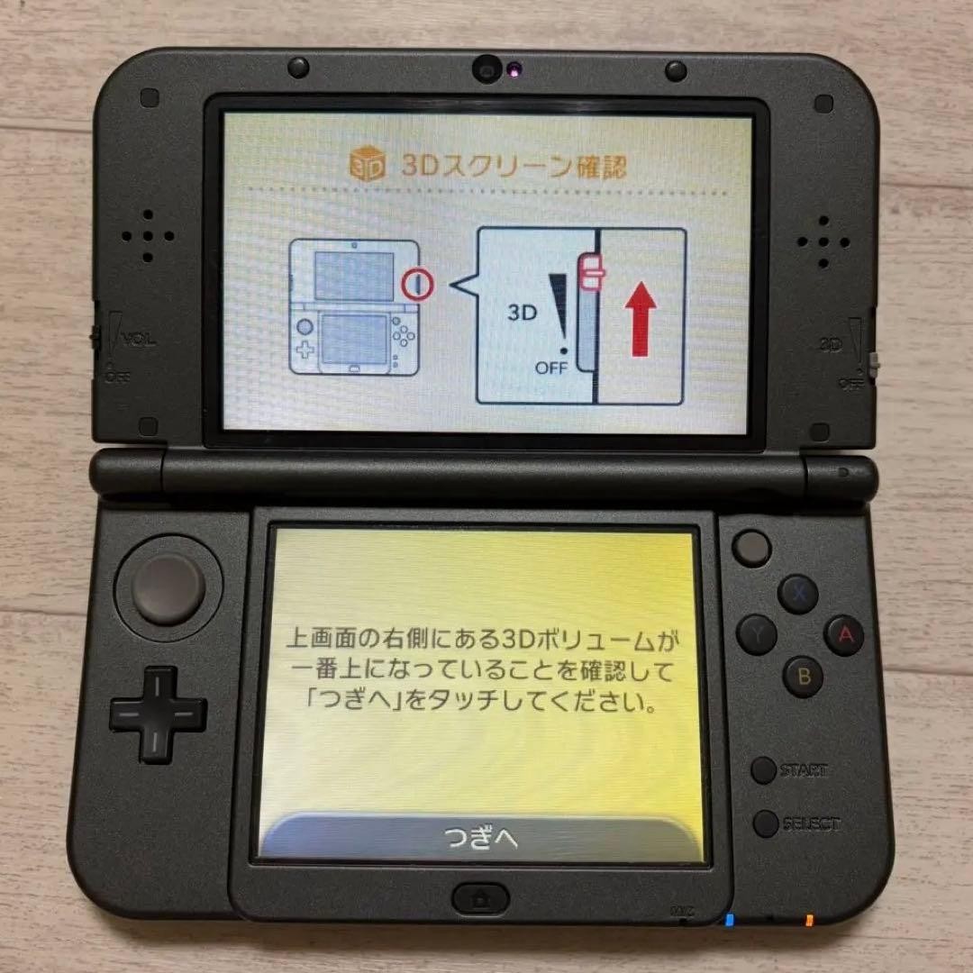 New Nintendo 3DS LL Metallic Black includes charging cable