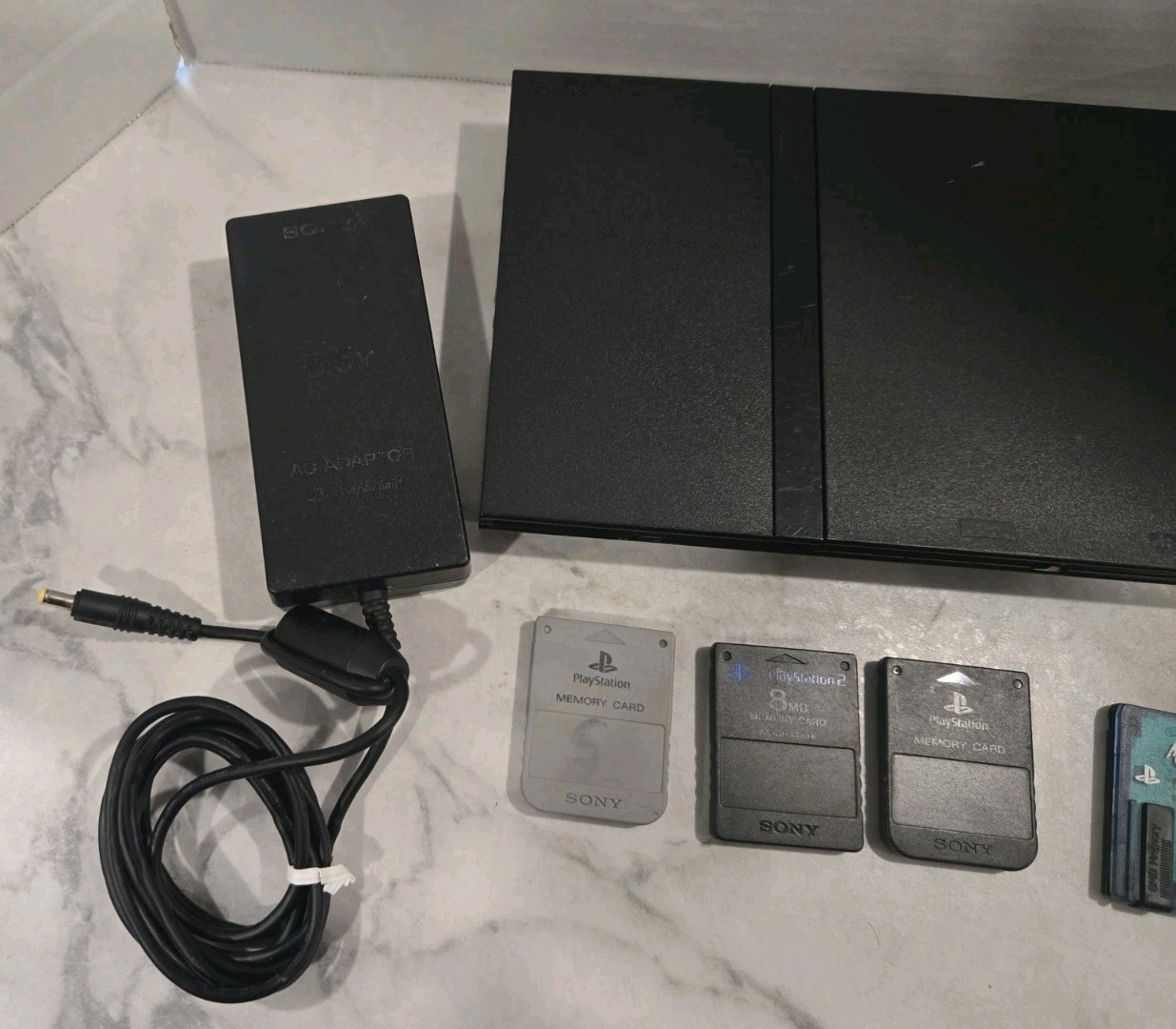 Sony PlayStation 2 Slim Black SCPH-70012 Bundle-2 Controllers & 4 Memory Cards