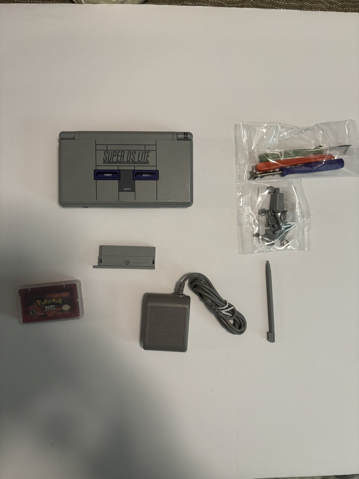 Nintendo ds Lite SNES Reshell With Charger, Ruby and screwdriver/buttons