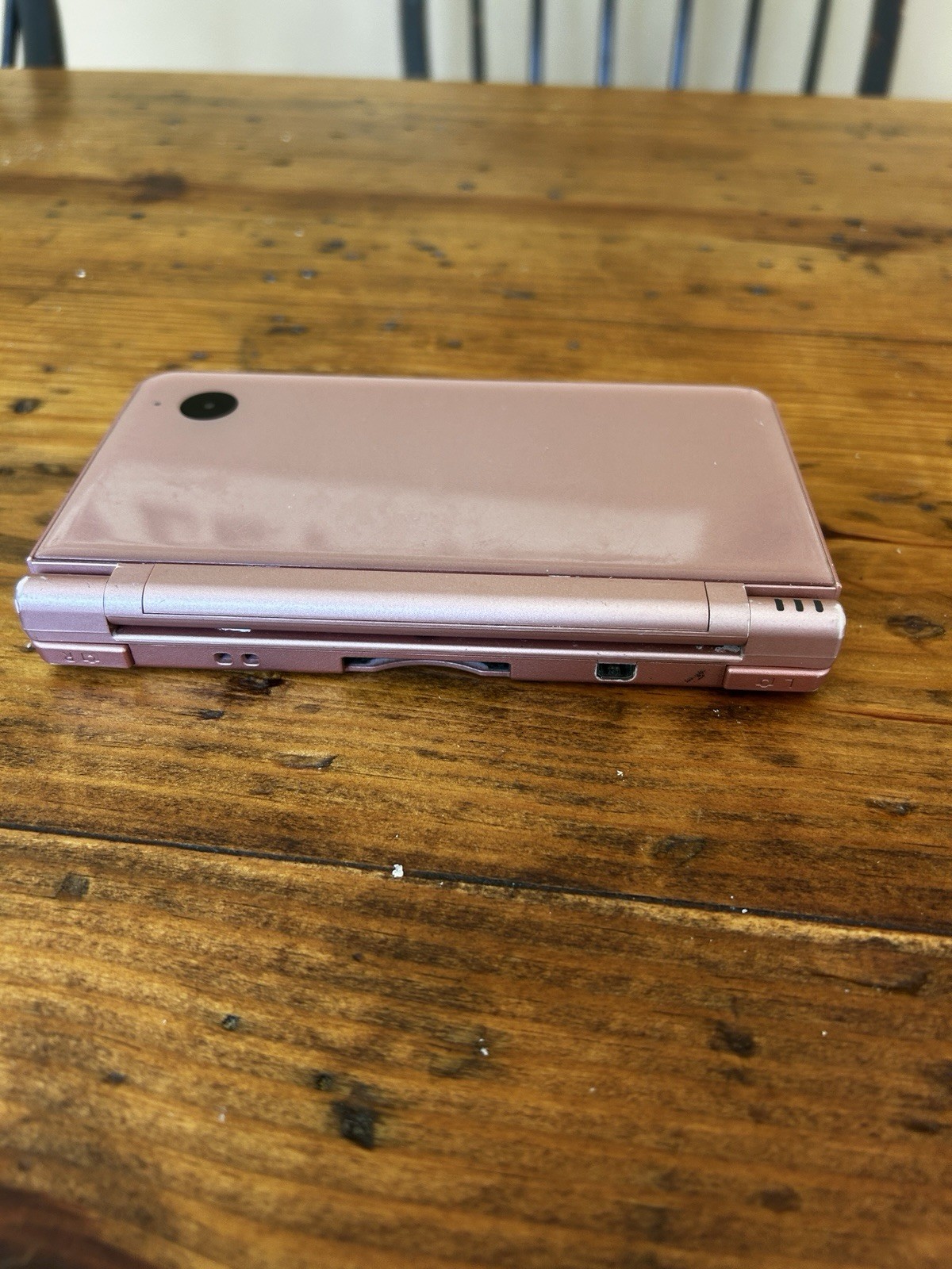 Nintendo DSi XL Metallic Rose Handheld System (No charger, pen or accessories)