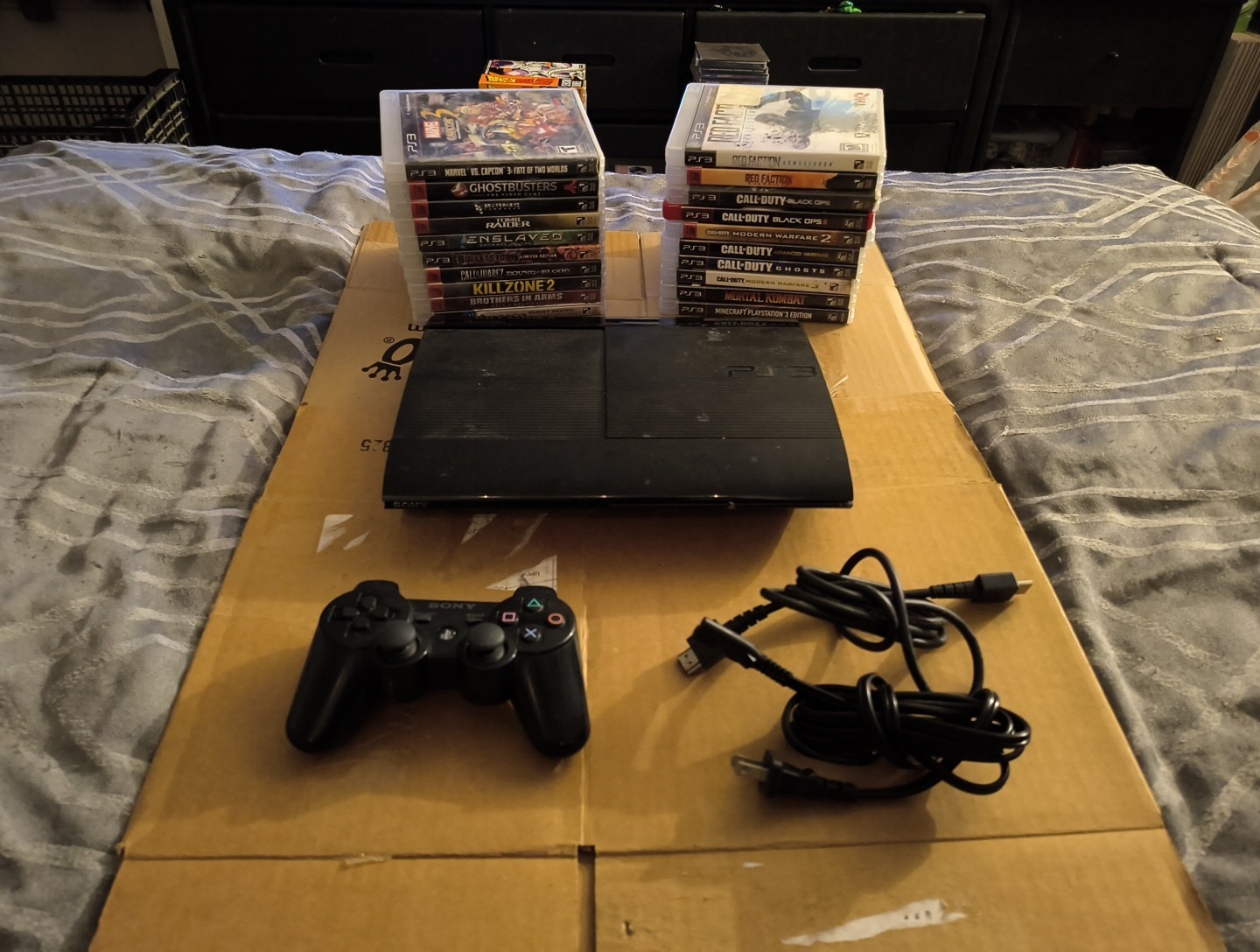 PlayStation 3 PS3 Super Slim 250 GB Console with 2 DualShock 3 + 20 Games