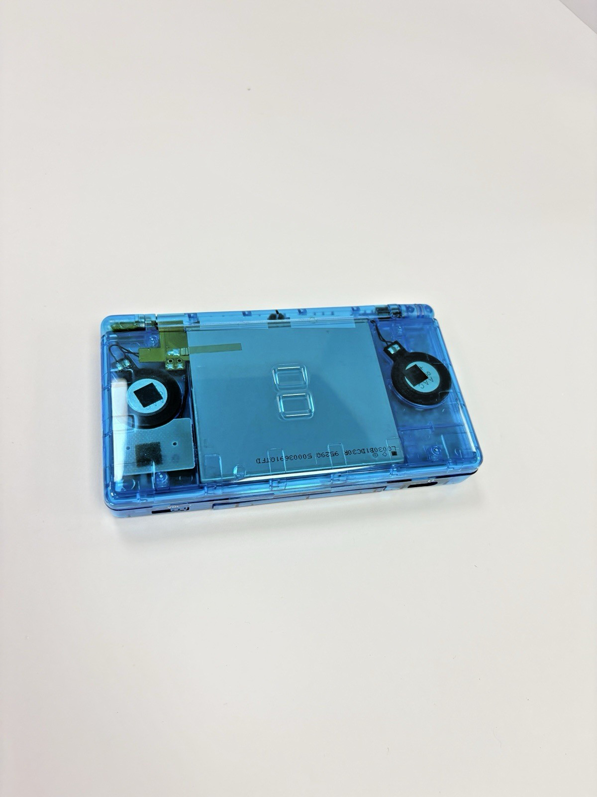 Refurbished Nintendo DS Lite Handheld – Transparent Blue – New Shell