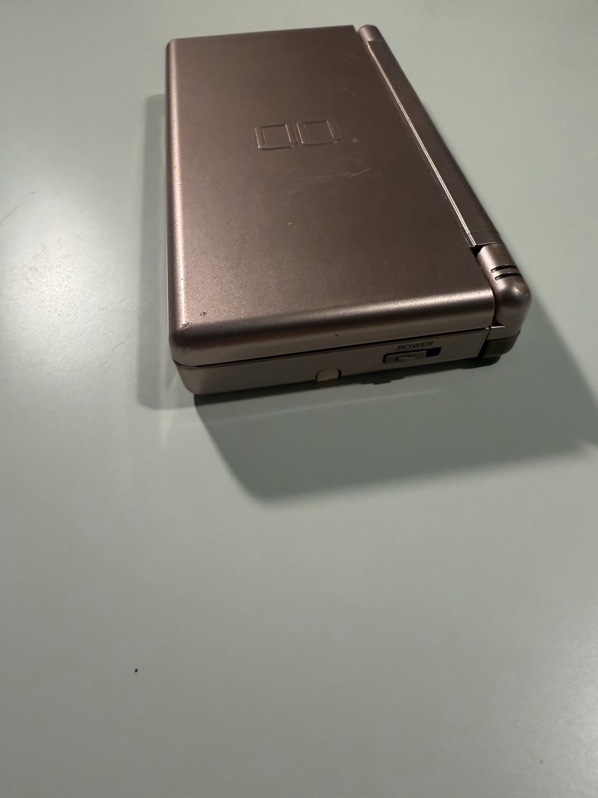 Nintendo DS Lite Metallic Rose System With Charger, Original Box, And 2 Cases