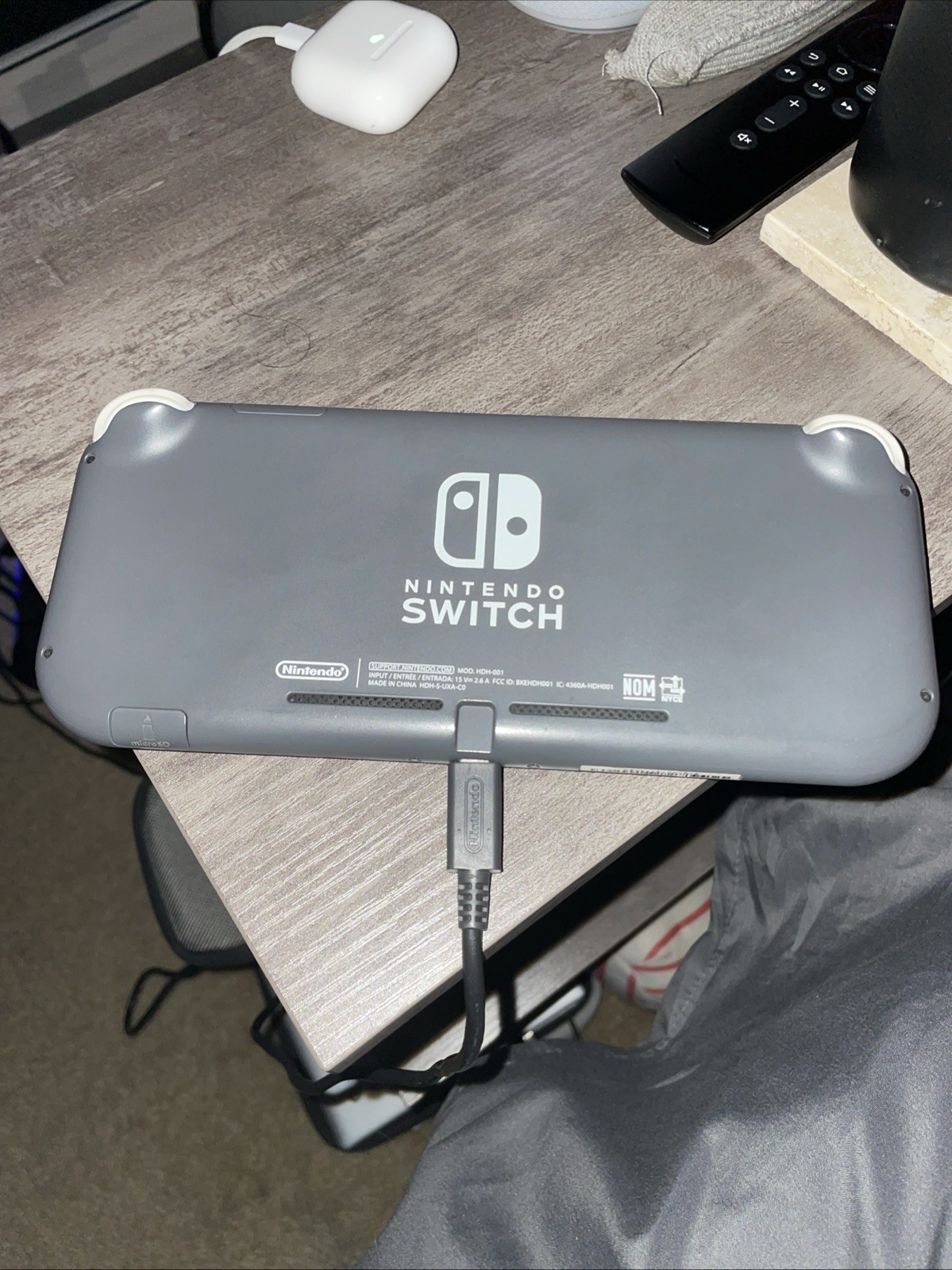 Nintendo Switch Lite.includes charger case and super Mario odyssey, couldadd2k18