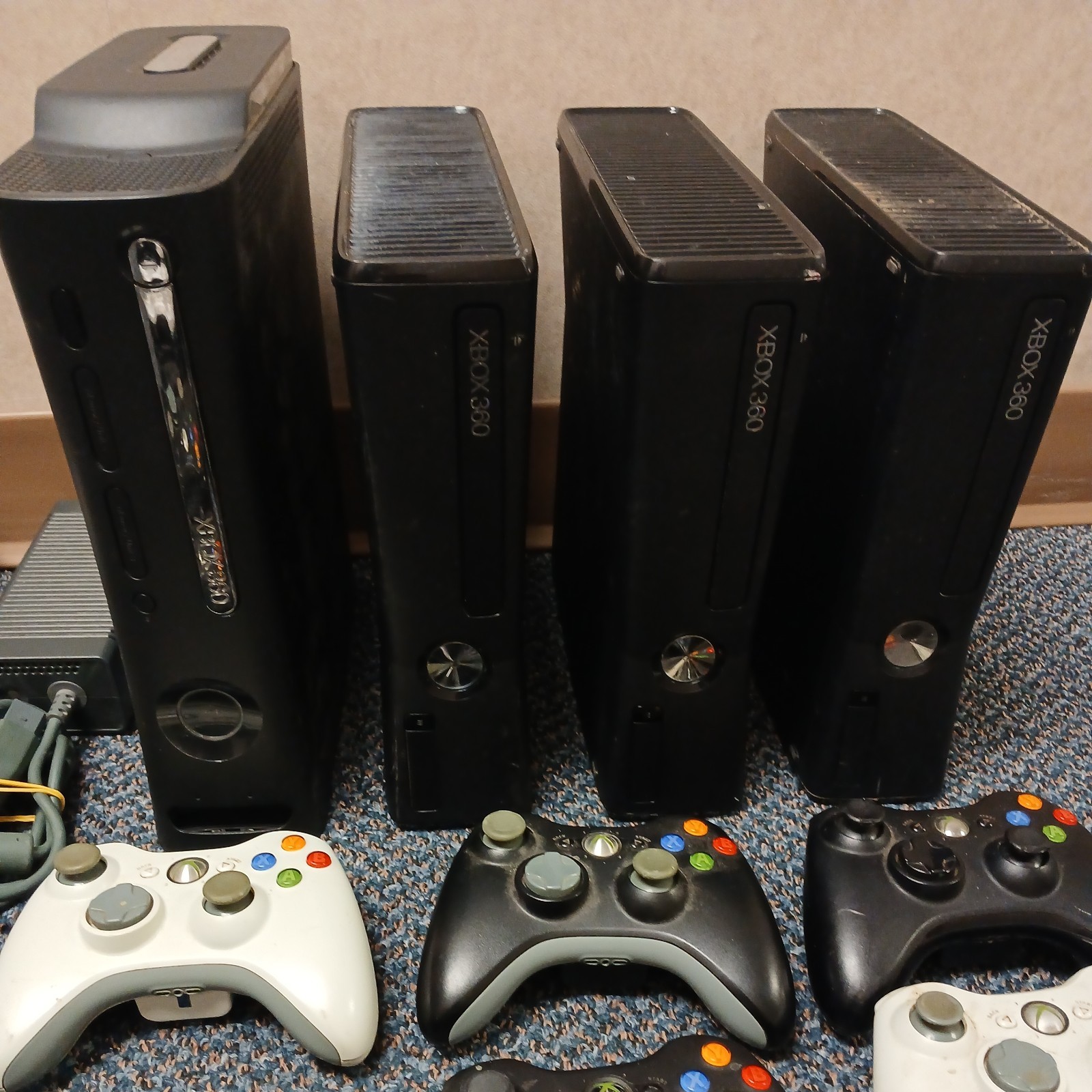 Lot Of 4 Xbox 360, 9 controllers. Most work the other for parts or repair.