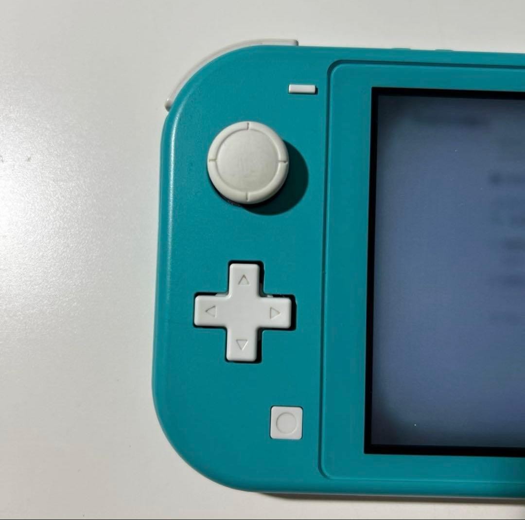 Nintendo Switch Lite Turquoise console with charger light blue
