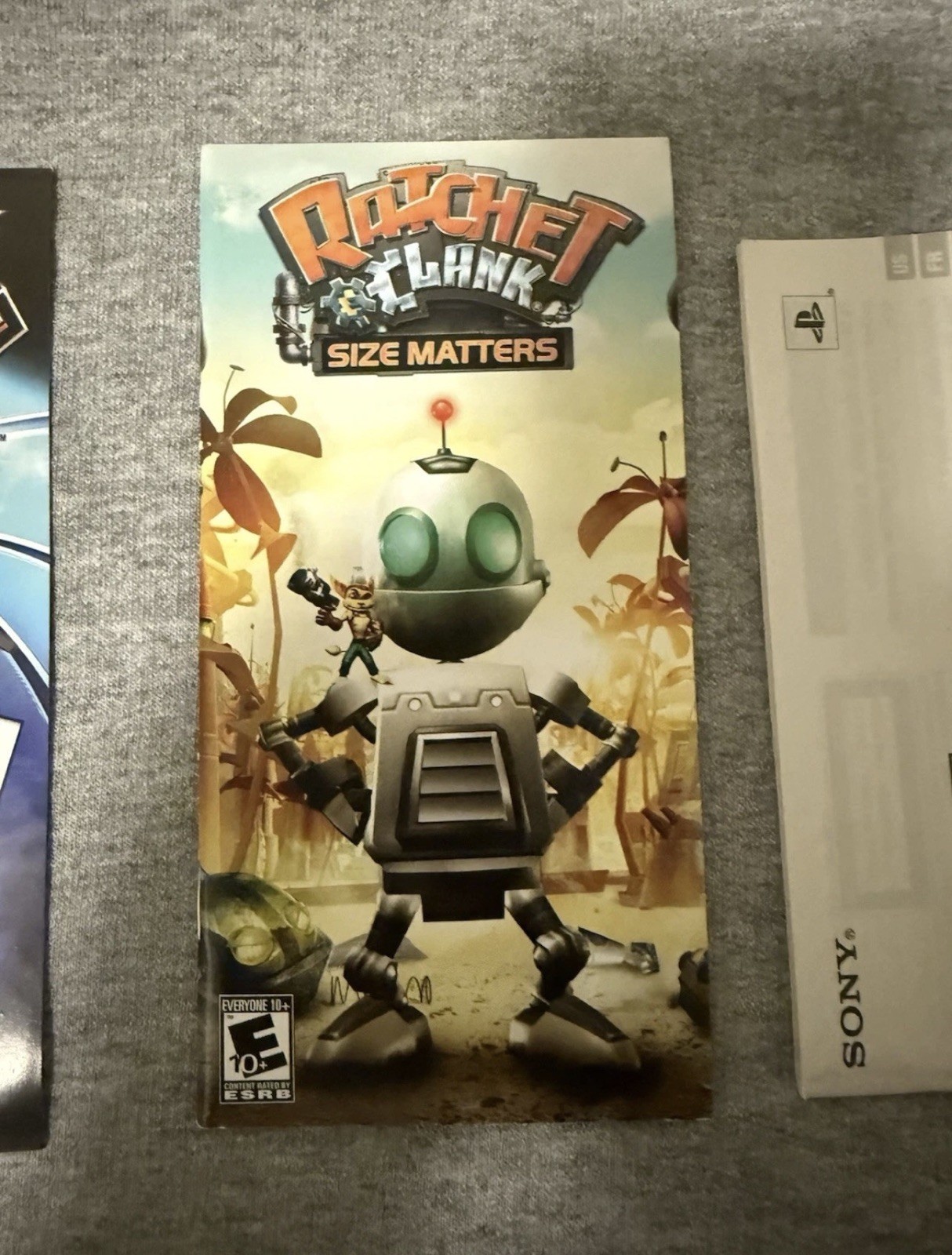 Sony PSP-3000 Silver Ratchet & Clank Size Matters Entertainment Pack Wi-Fi 1GB