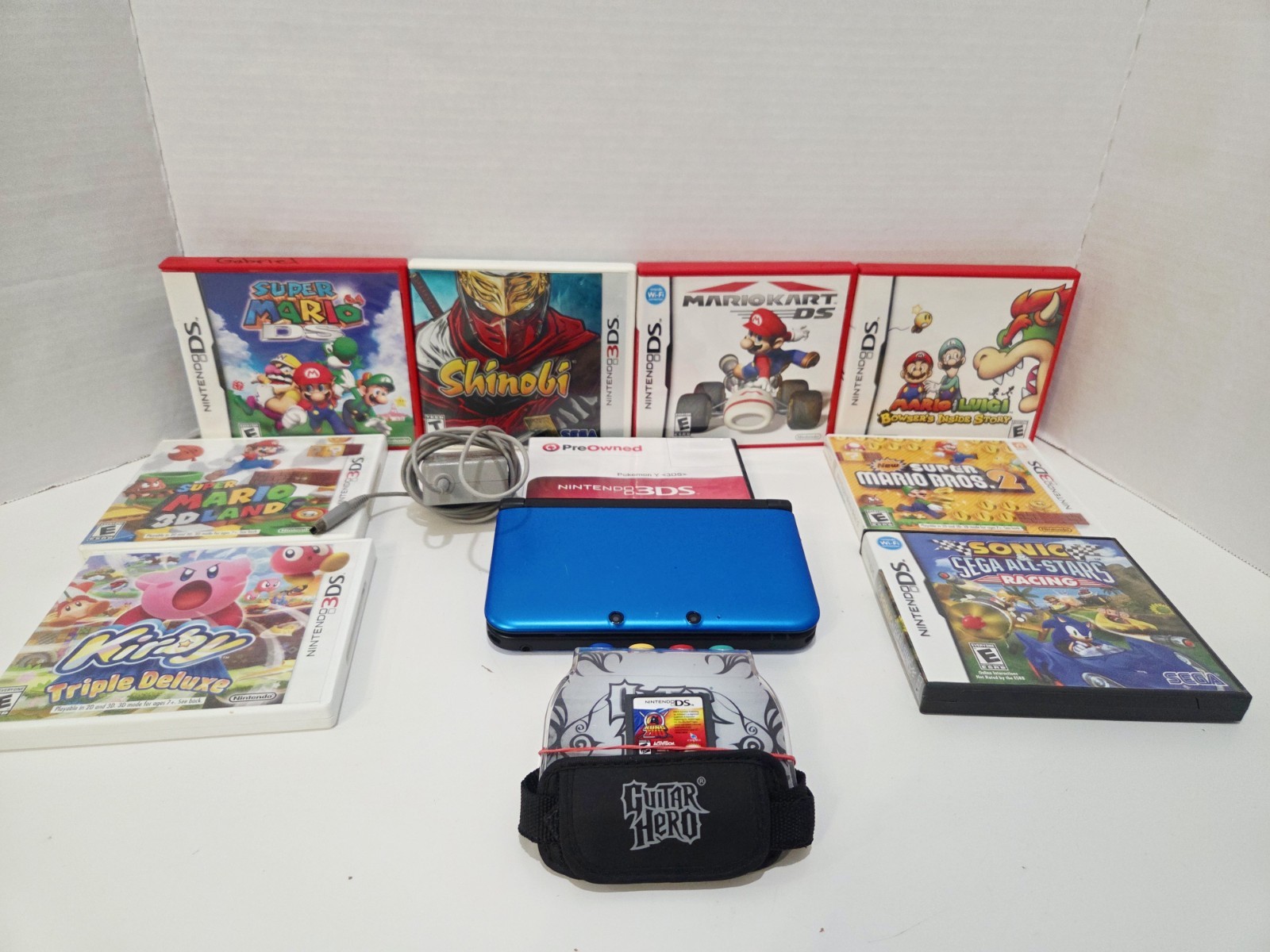 Nintendo 3DS XL Blue w/ Charger & 11 Games, Stylus & Guitar Hero Control Grip