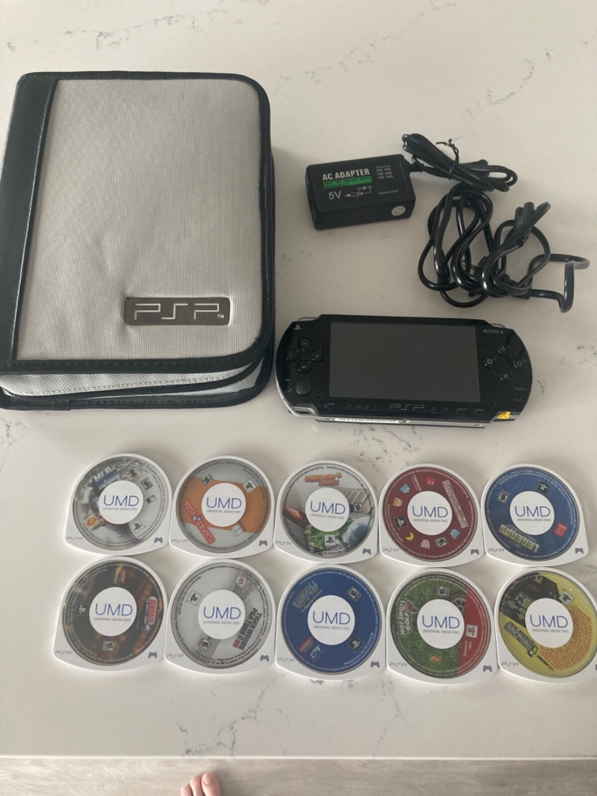 PSP complete with 10 games carrying case and power cord
