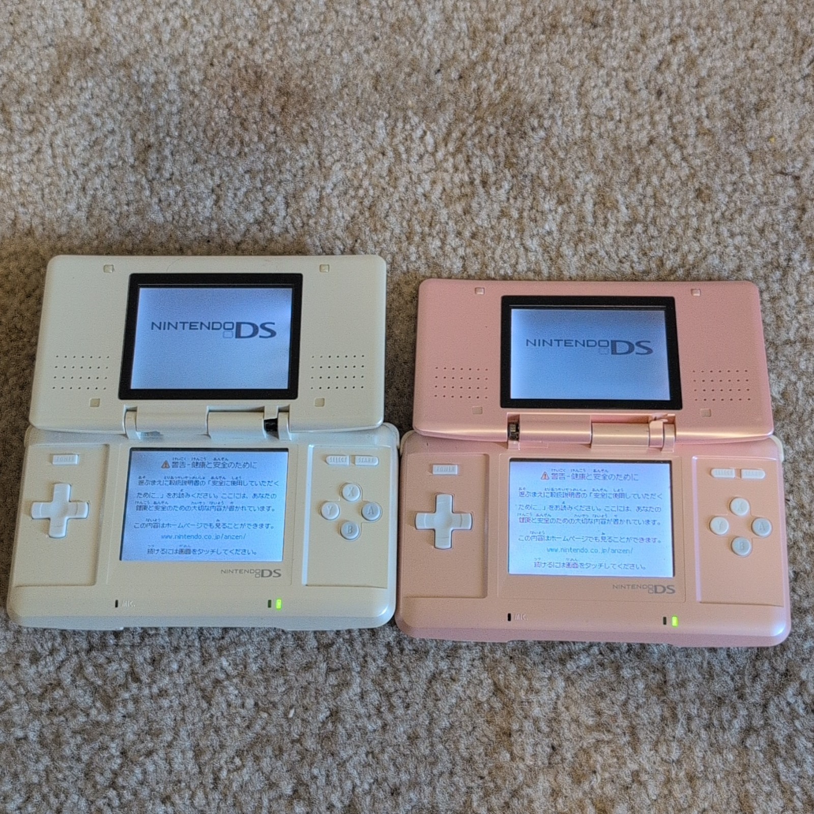 Lot Of 2 Nintendo DS White And Pink ,BROKEN HINGES NO CHARGER, TESTED AND WORKS.