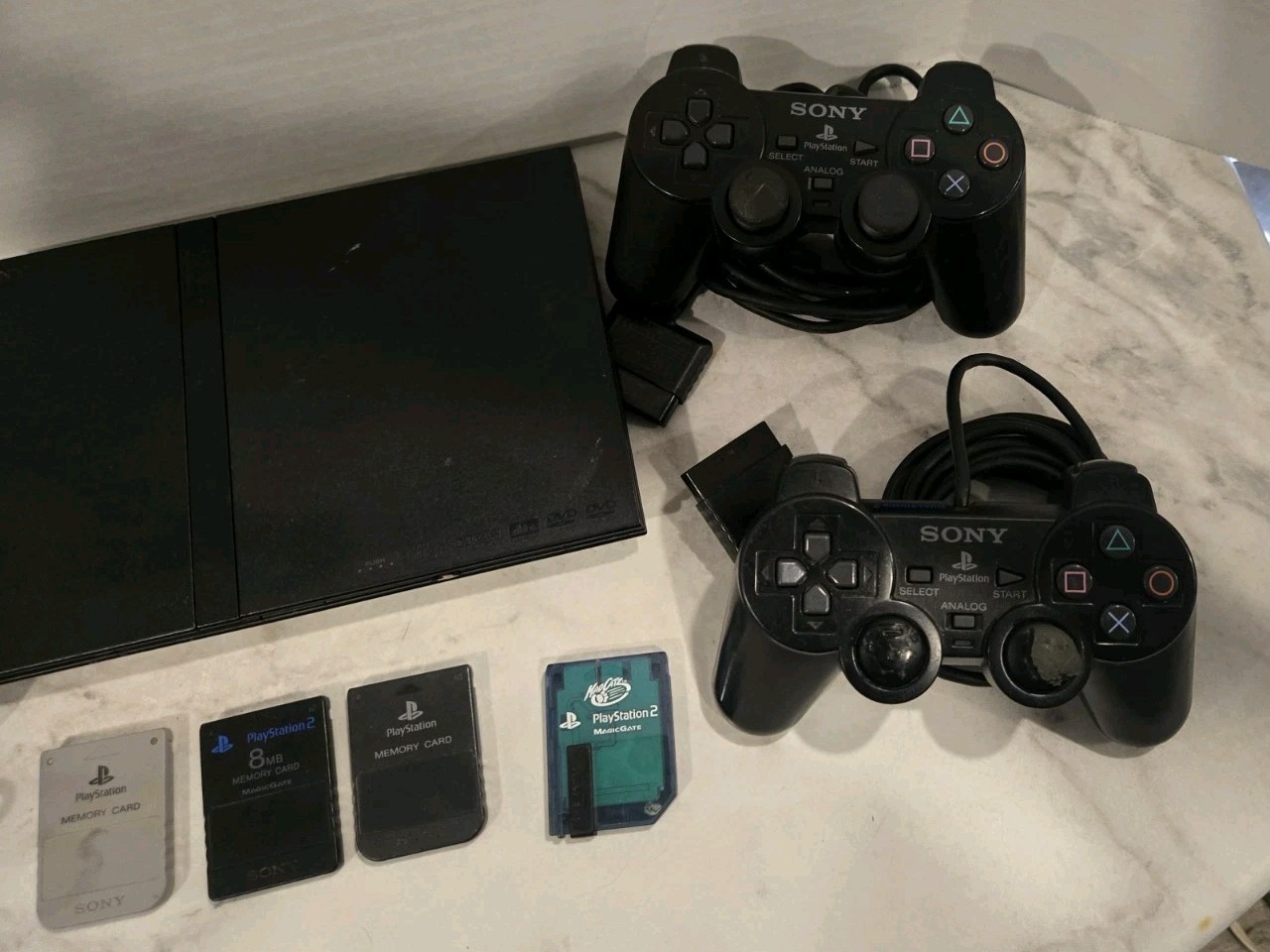 Sony PlayStation 2 Slim Black SCPH-70012 Bundle-2 Controllers & 4 Memory Cards