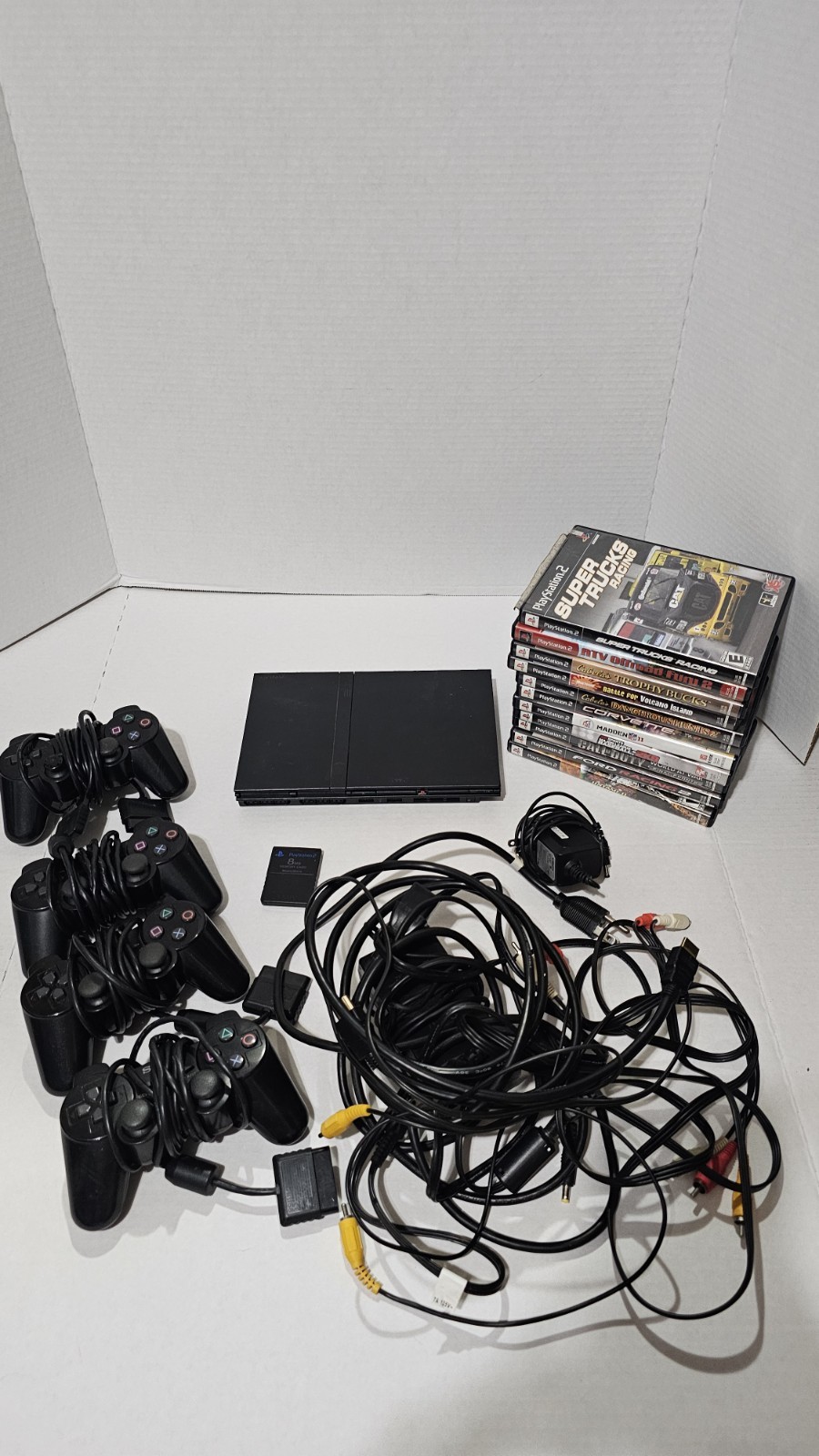 PlayStation 2 Slim with 4Controllers – Cords 8gb Memory Card And 11 Games.