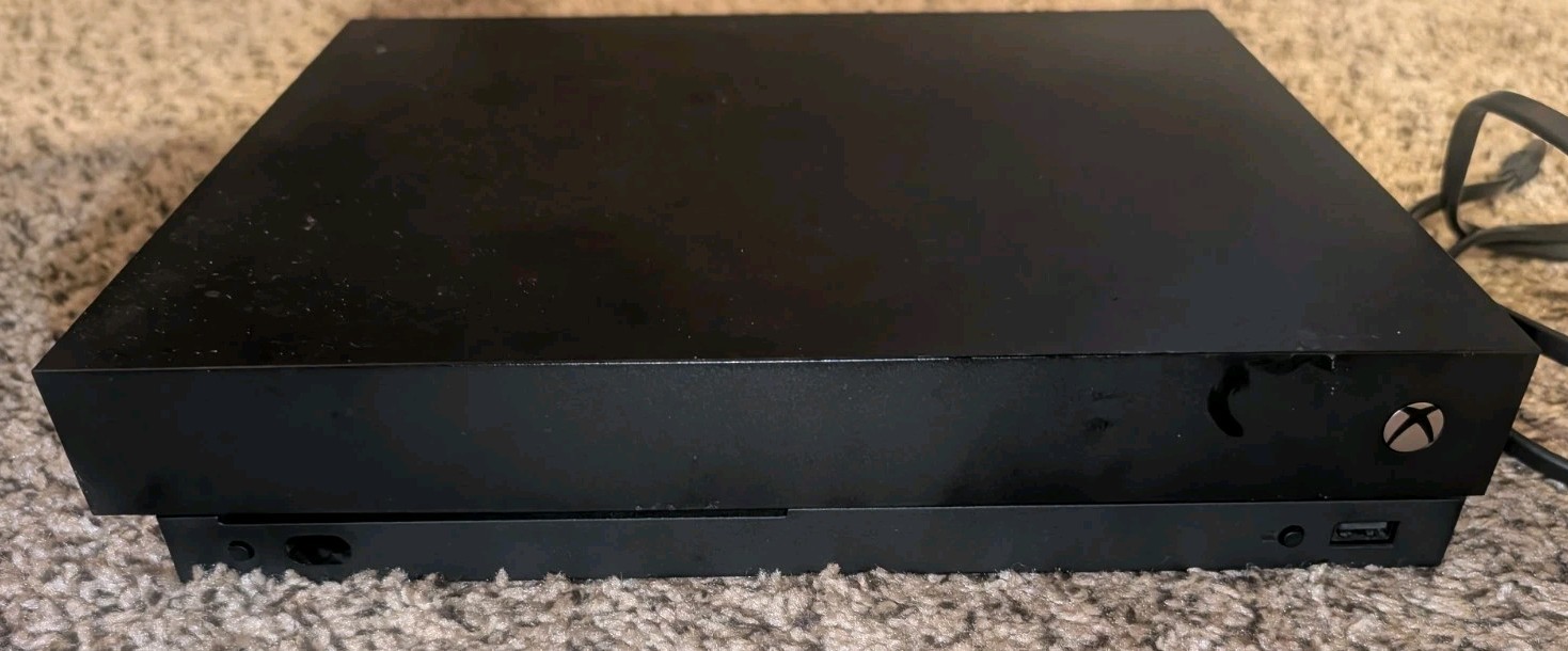 MICROSOFT Xbox ONE X 1787 with controller.