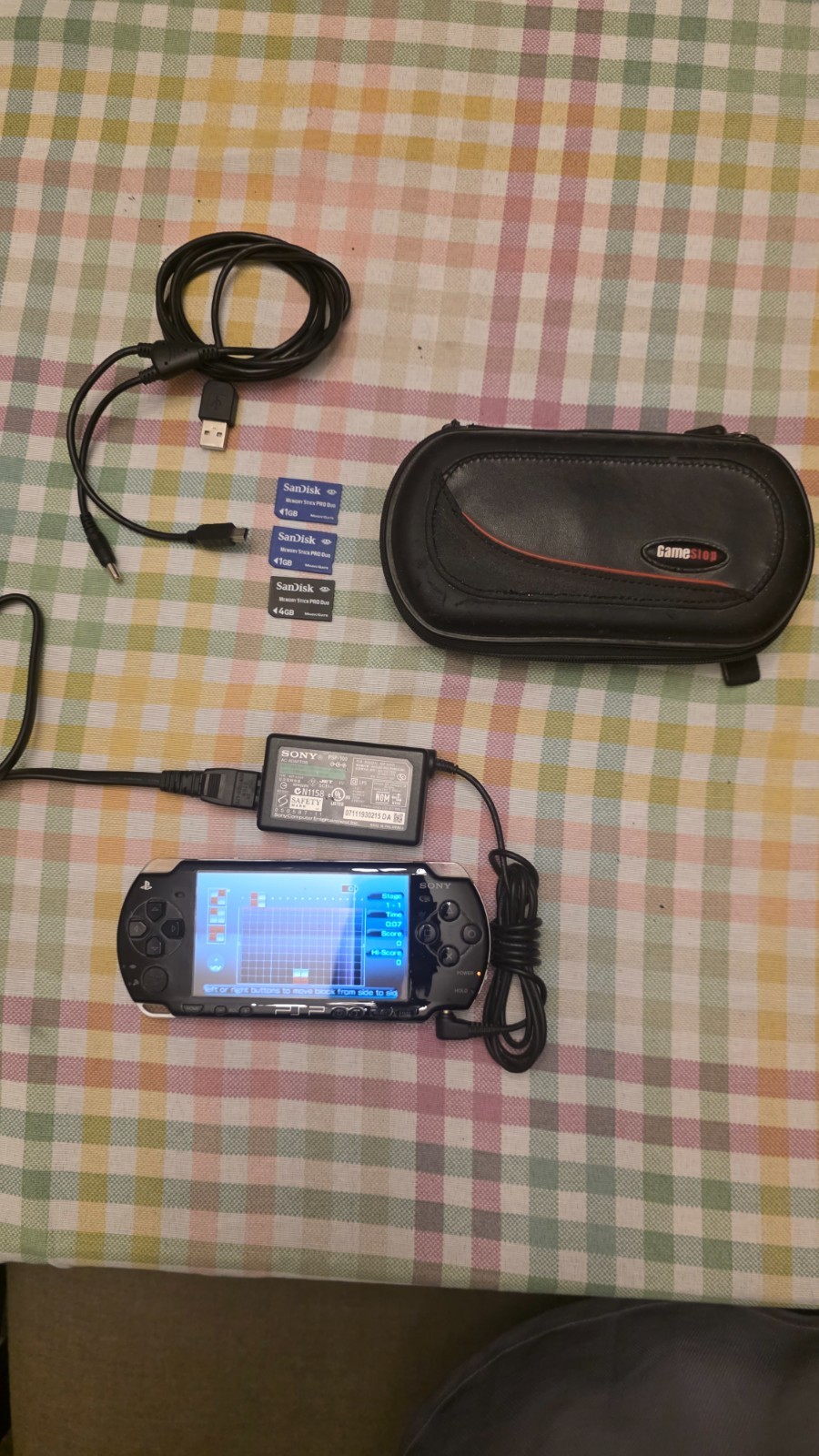 Sony PSP 2001 Console w/ AC Charger + 1 game + 4/1/1 GB – no battery