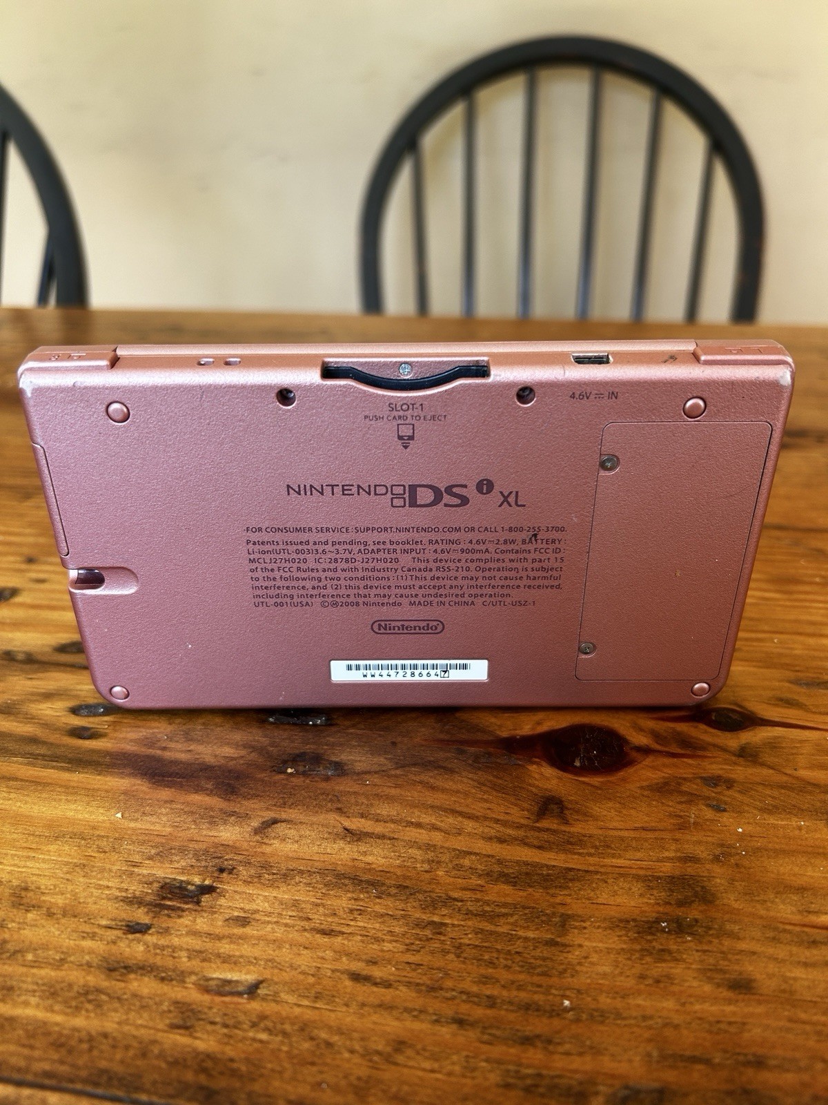 Nintendo DSi XL Metallic Rose Handheld System (No charger, pen or accessories)
