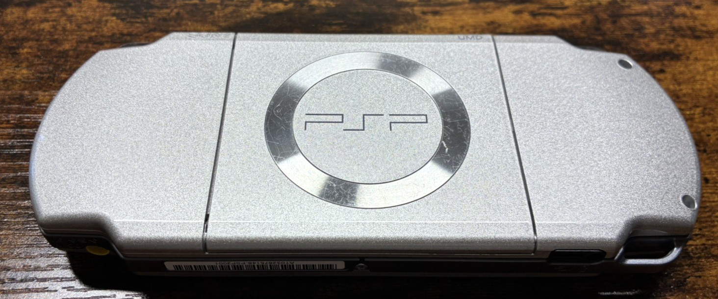 Sony PSP-2001 Silver Console NEW-Barely Used w/New Battery/Charger + 3 UMDs