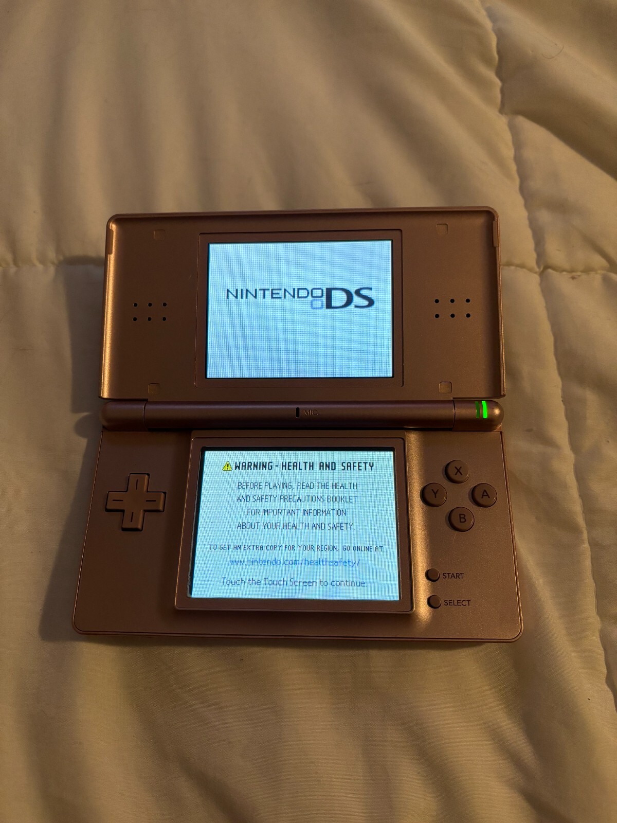 Pink Nintendo DS lite with Charger and Blue carrying case and charger w/ games