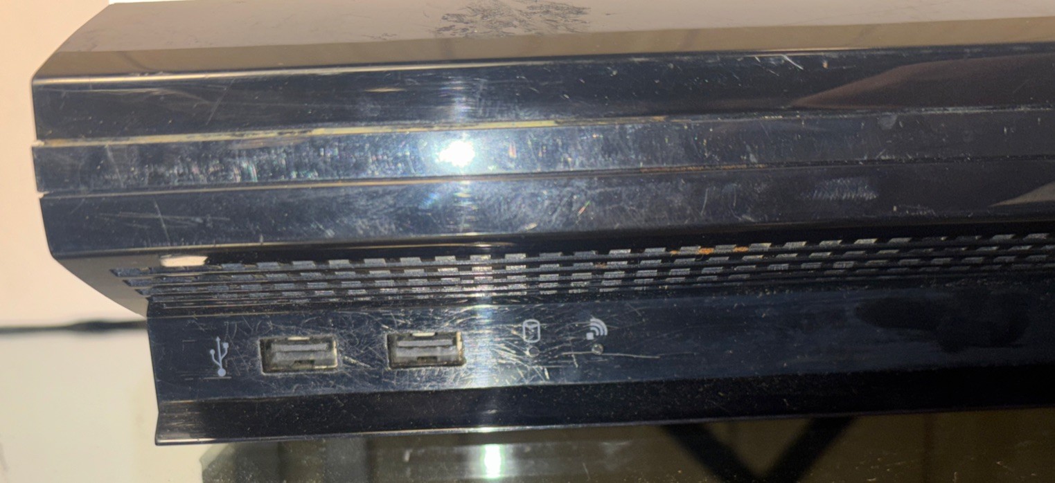 Black PlayStation 3 Console With Charging Cable