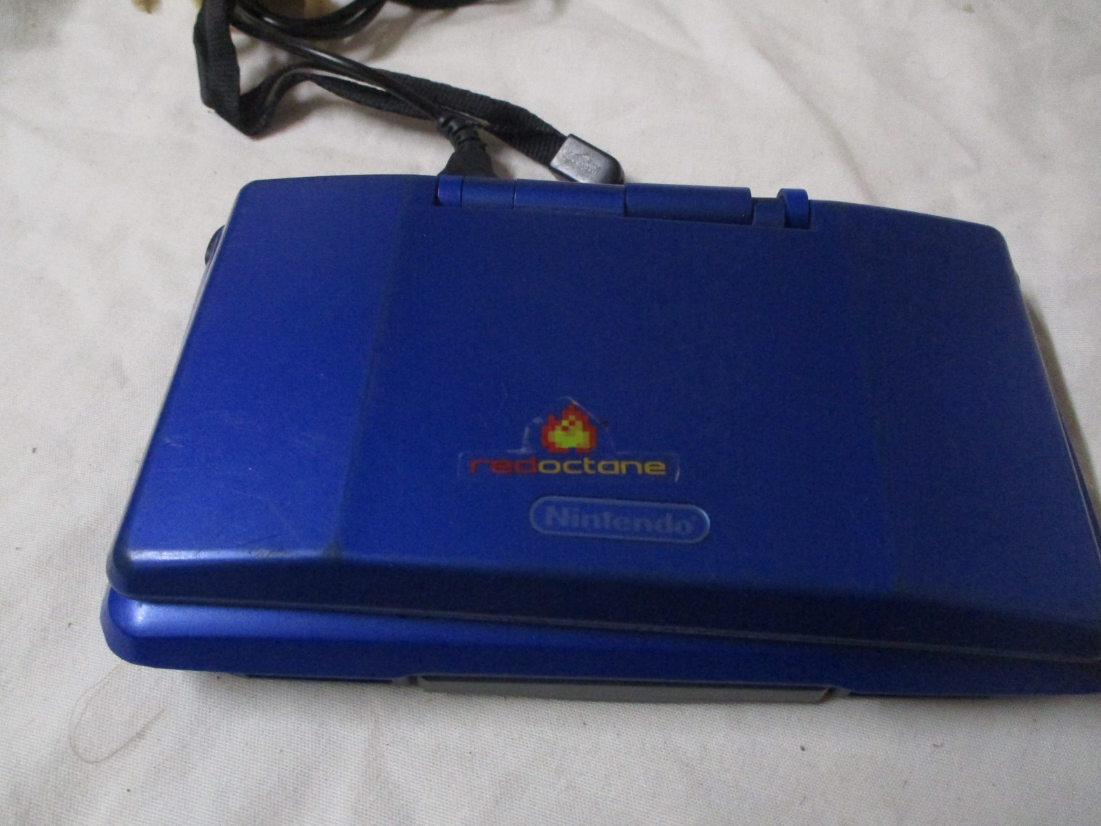 NINTENDO DS BLUE WITH GAMEBOY ADVANCE AND DS ABILITY 1 ARM BROKE