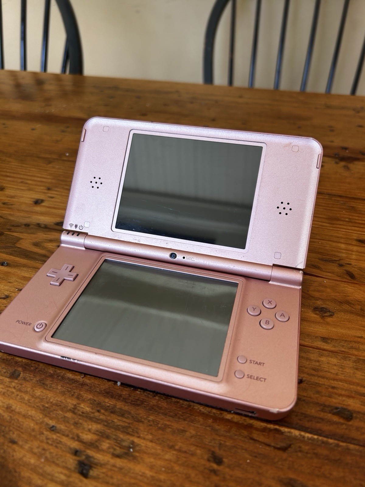 Nintendo DSi XL Metallic Rose Handheld System (No charger, pen or accessories)