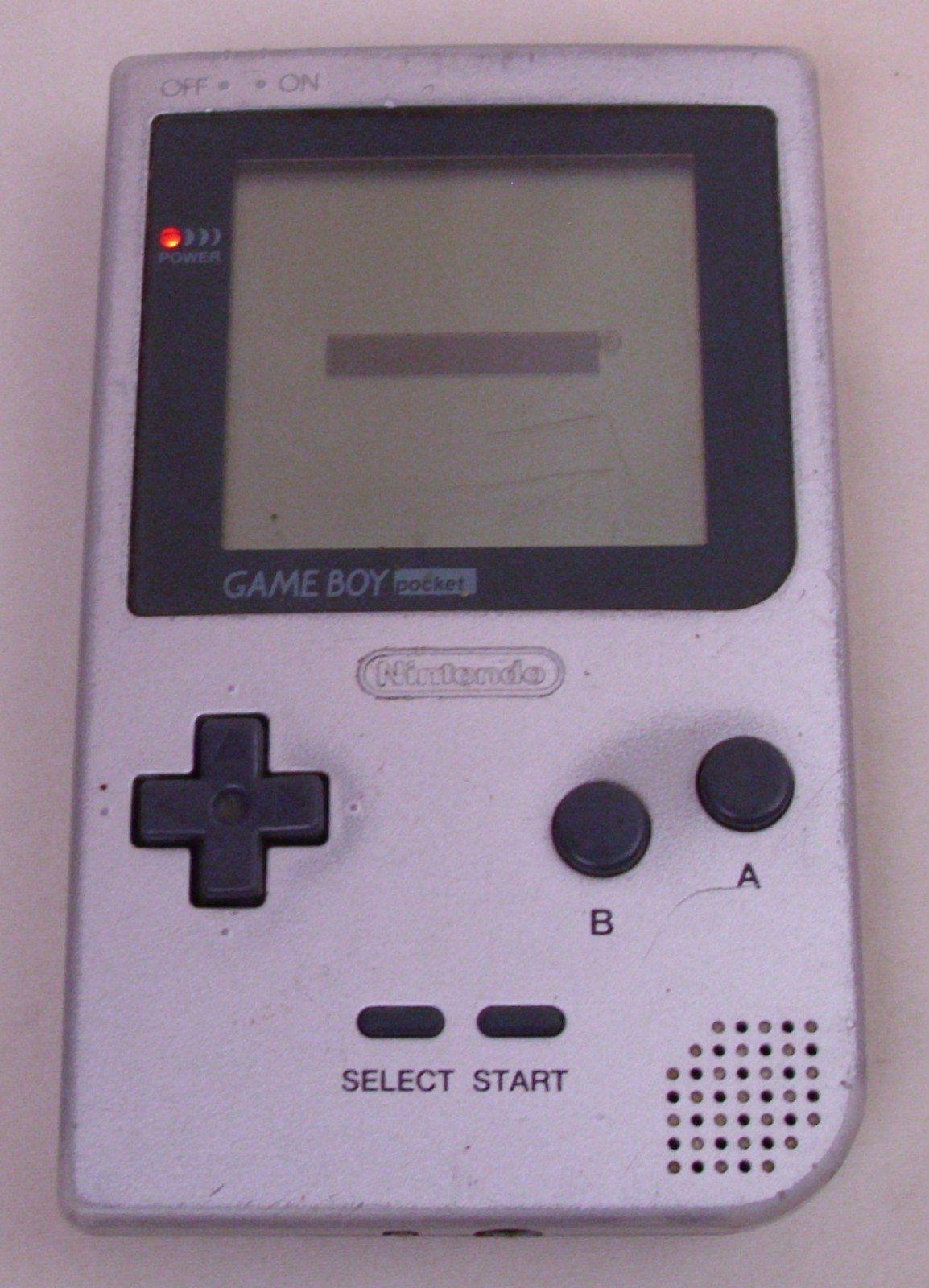 NINTENDO GAME BOY POCKET MODEL NO. MGB-001 WITH FOUR GAMES