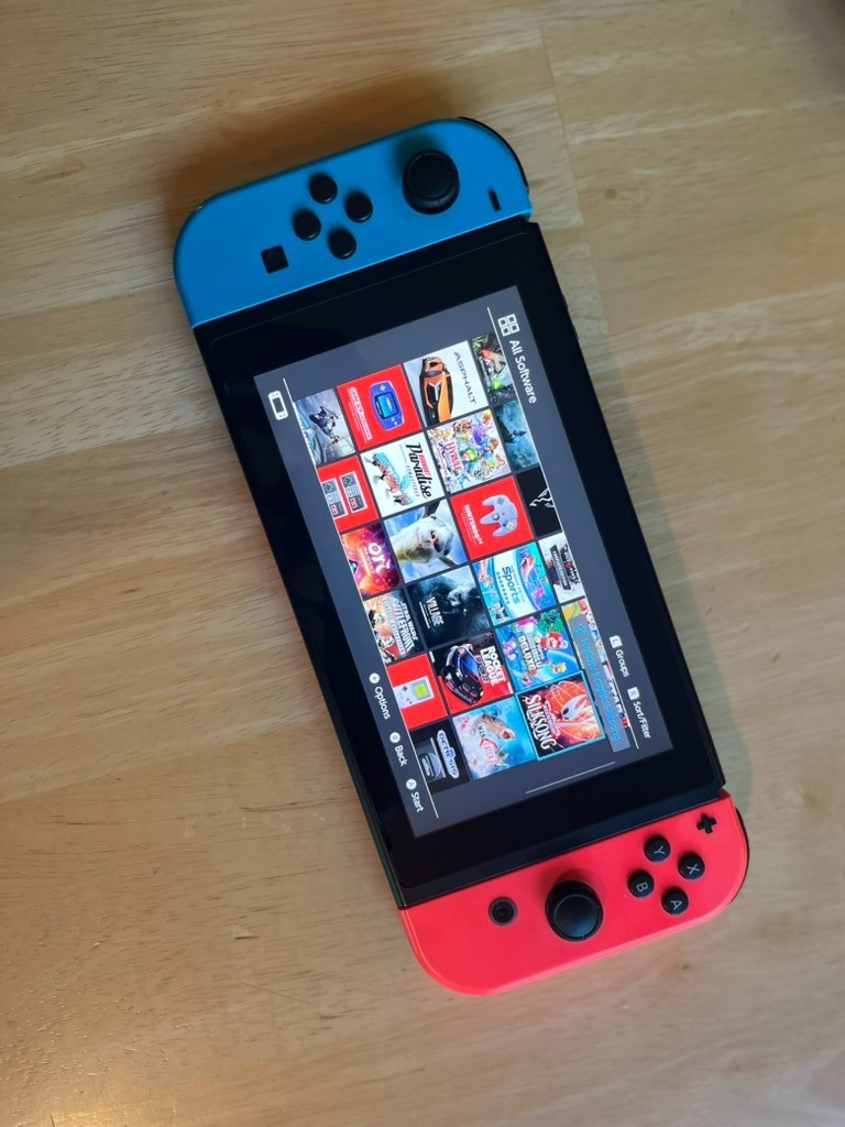 Nintendo Switch Console Bundle – Neon Red/Blue + White Joy‑Cons + Games + Case