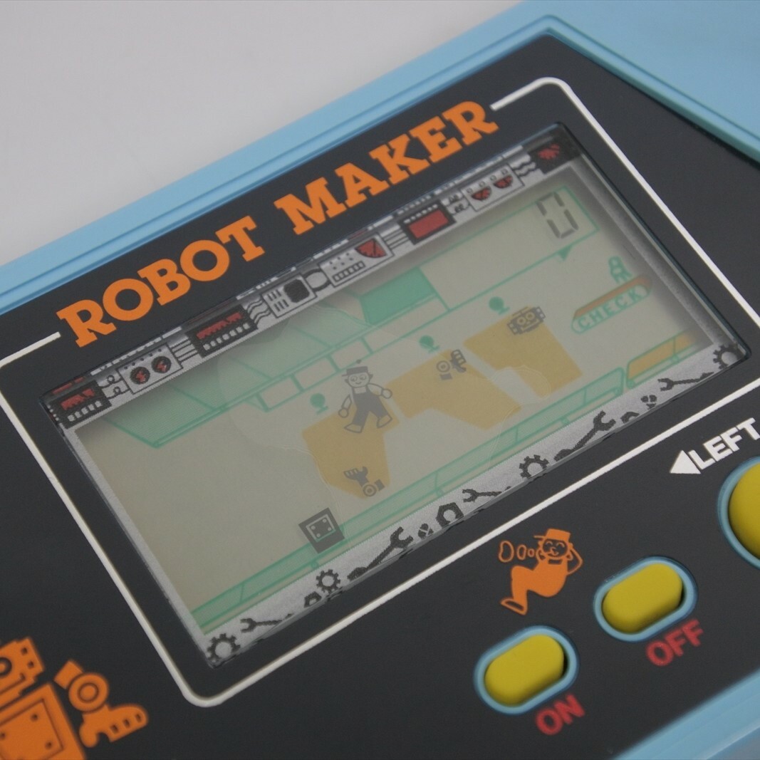LCD ROBOT MAKER Handheld Console Game Takatoku Toys Game Watch Tested Ref 0832