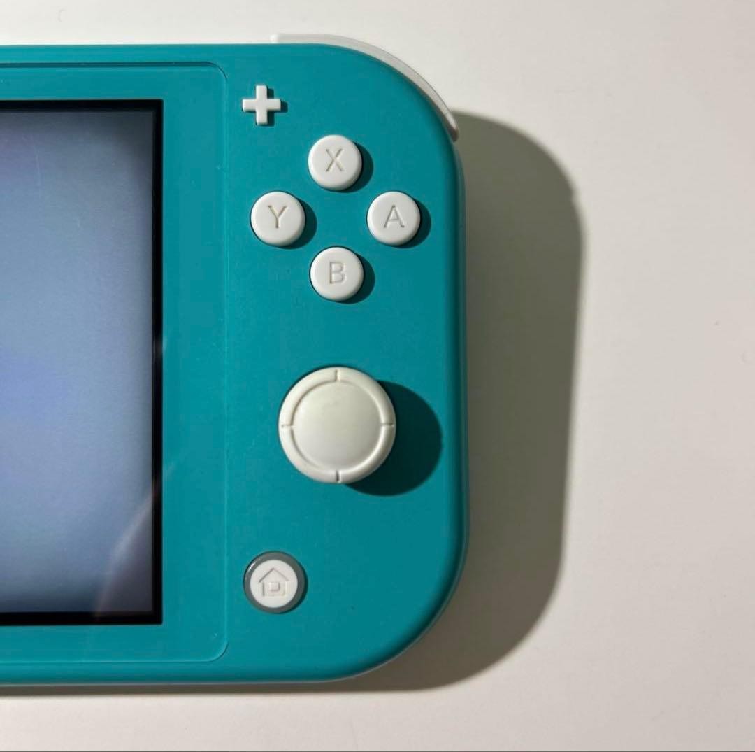 Nintendo Switch Lite Turquoise console with charger light blue