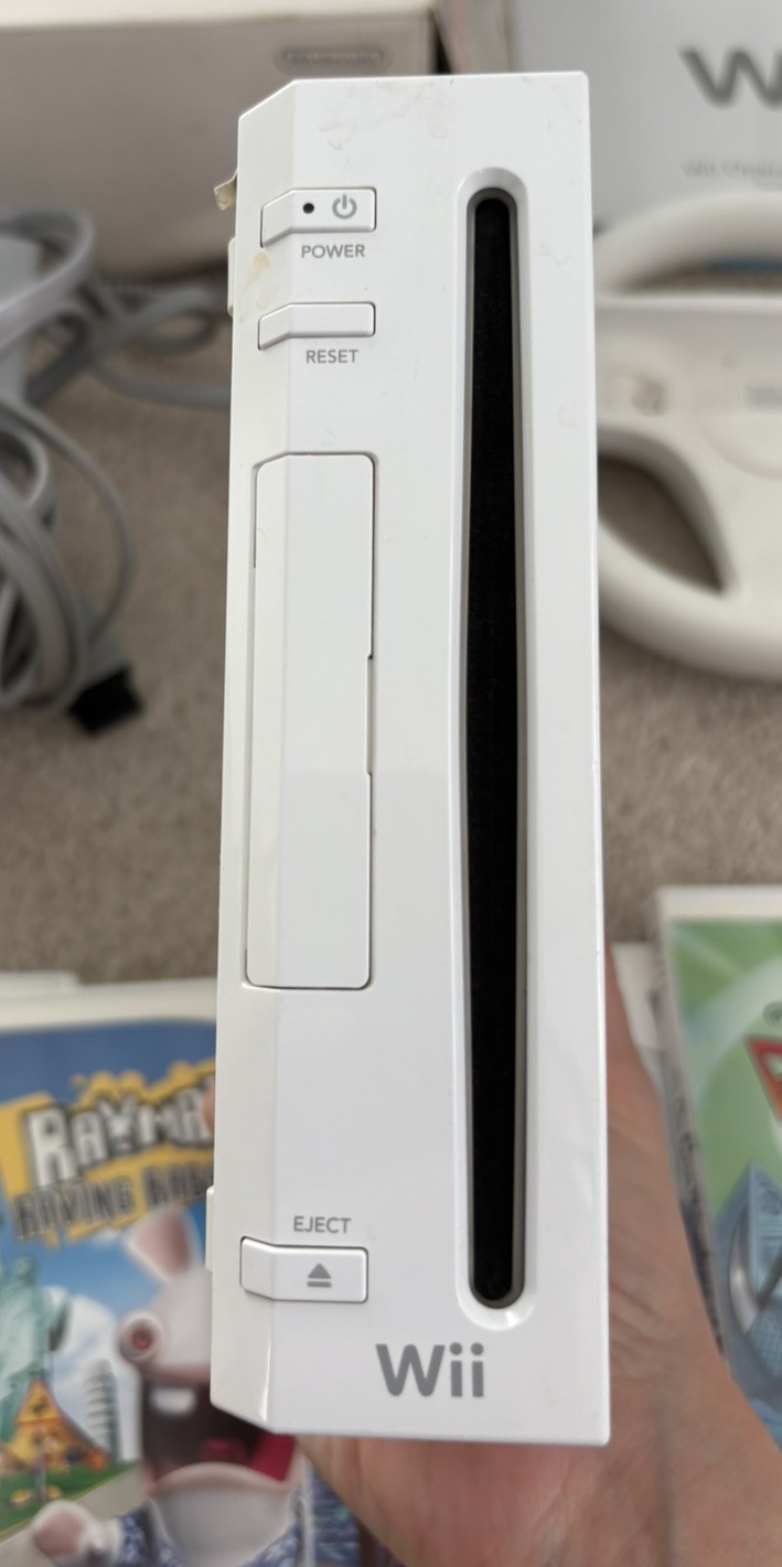 Nintendo Wii Bundle With 6 Games, Console Stand, Plug, Sensor & NO controllers