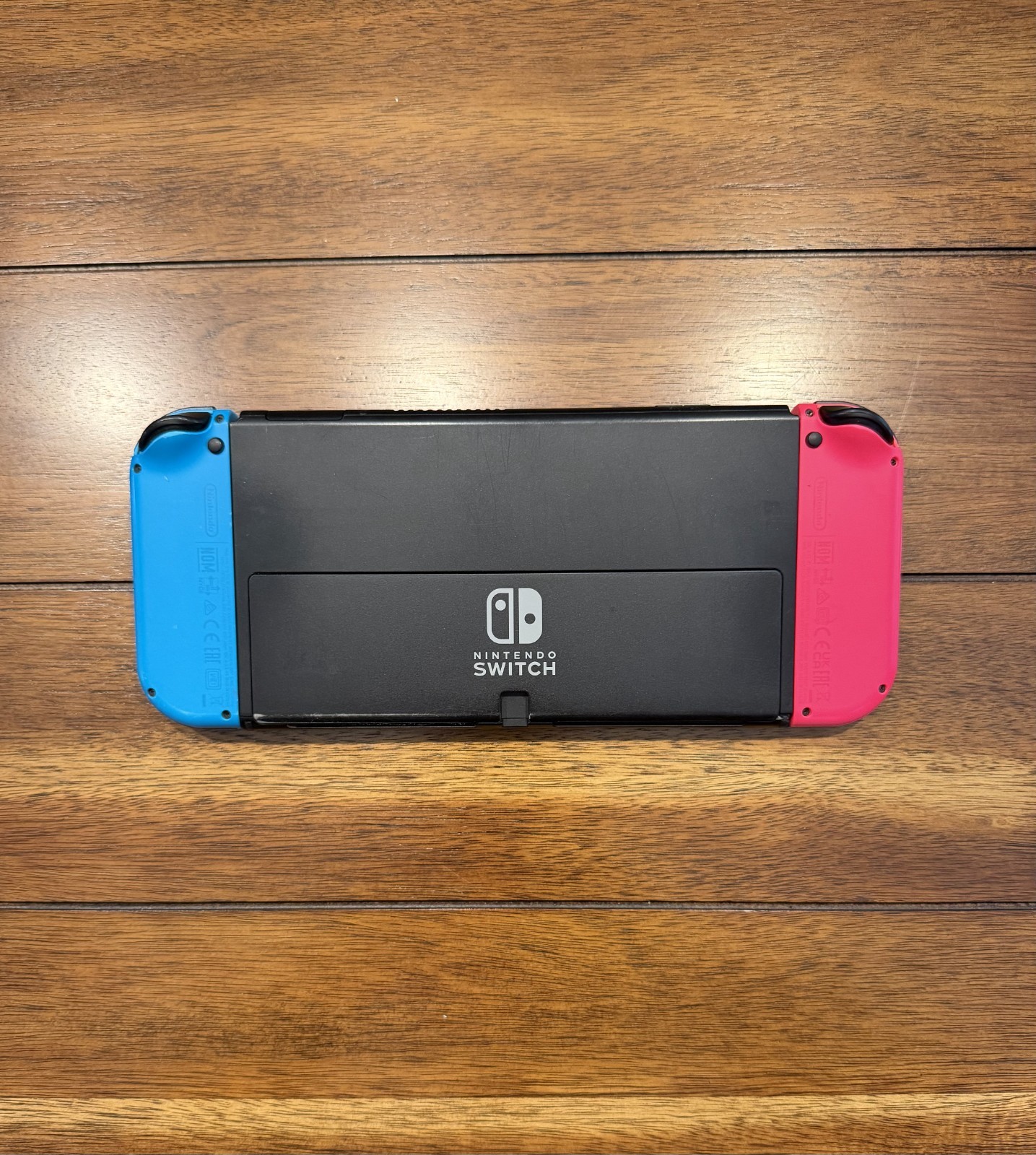 Nintendo HEGSKABAA Switch – OLED 64GB, with Neon Red & Blue Joy Con-very Good
