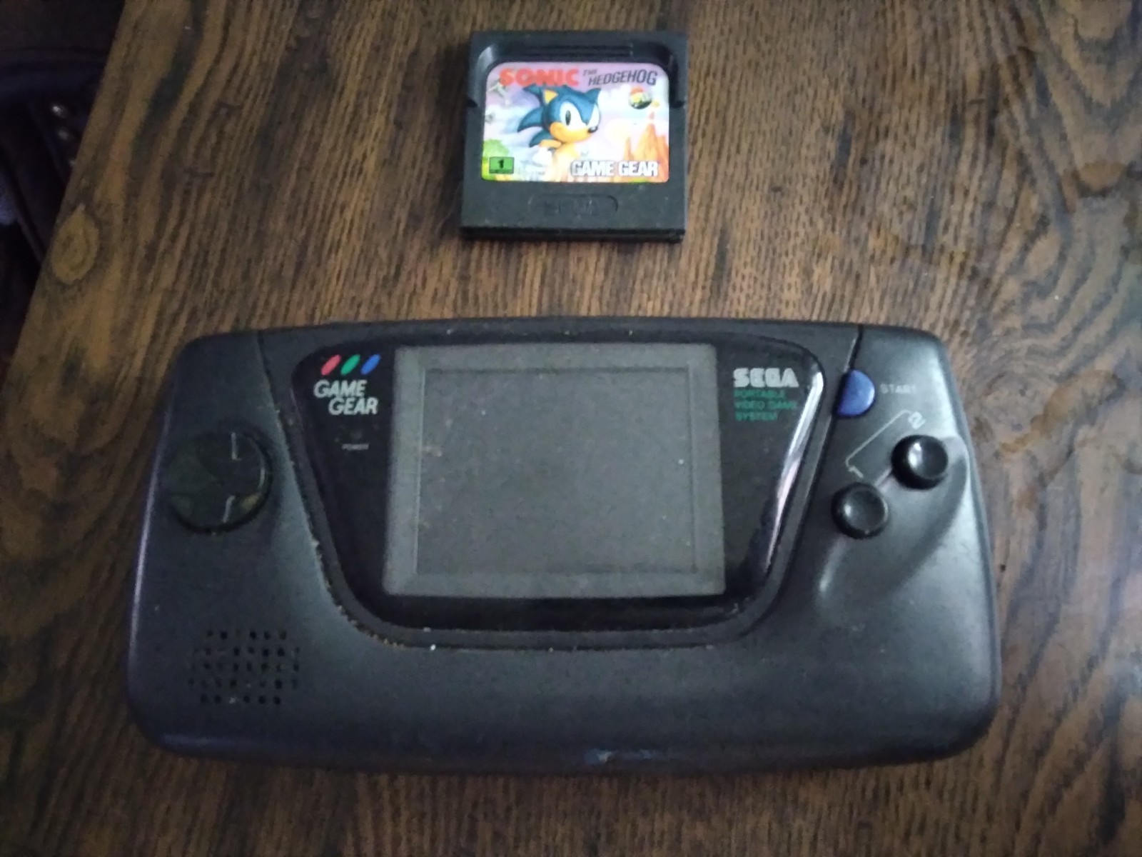 Sega Game Gear Console Powers On Not working With Game For Parts Or Repair Only
