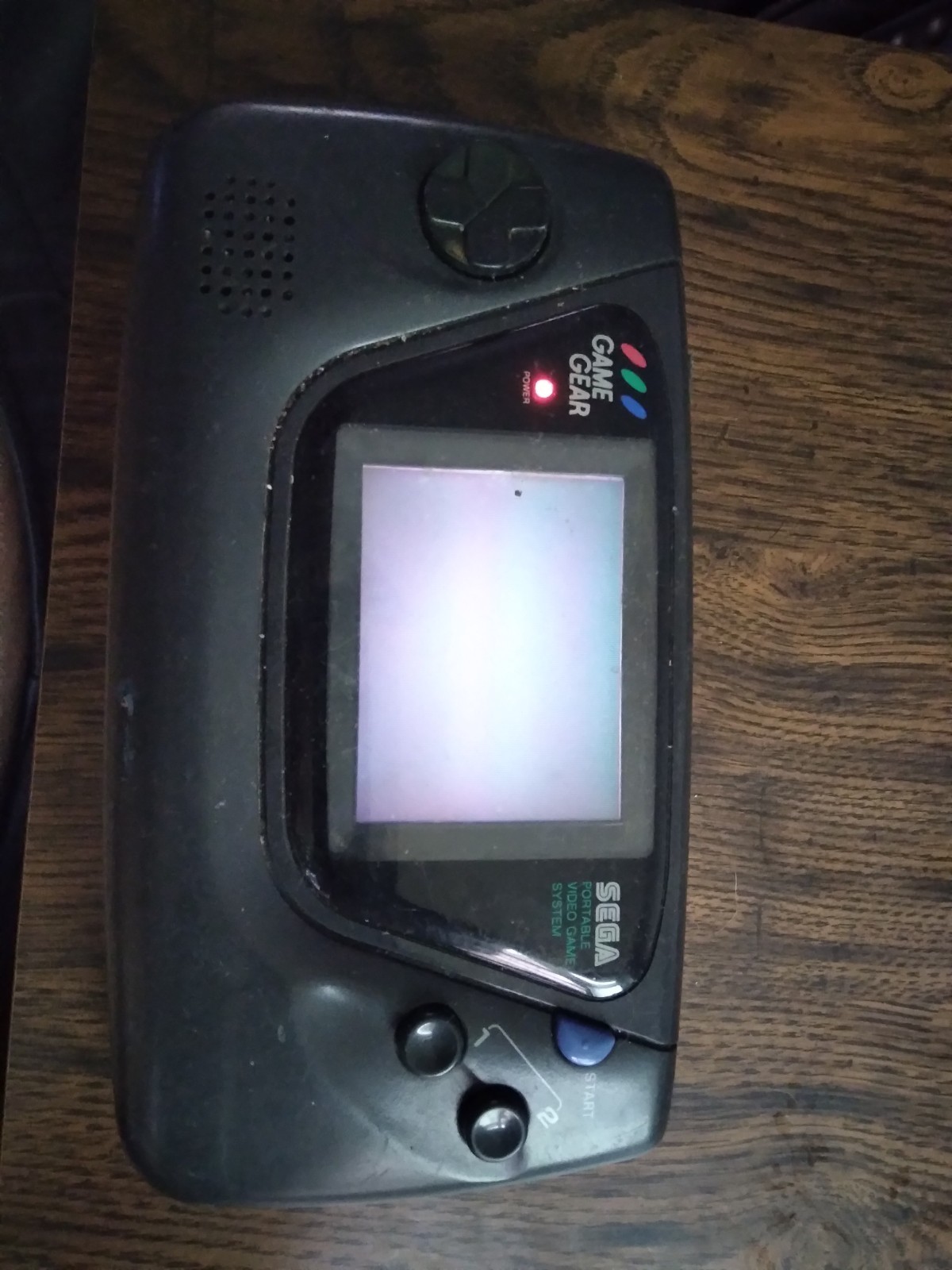 Sega Game Gear Console Powers On Not working With Game For Parts Or Repair Only