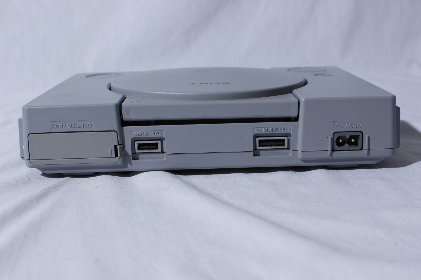 Sony Playstation 1 Gray Console With Blue Sony Controller, A/V Cable, and Power