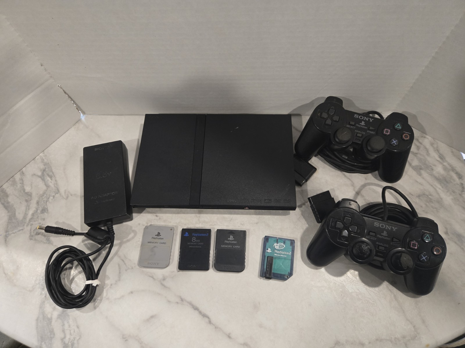 Sony PlayStation 2 Slim Black SCPH-70012 Bundle-2 Controllers & 4 Memory Cards
