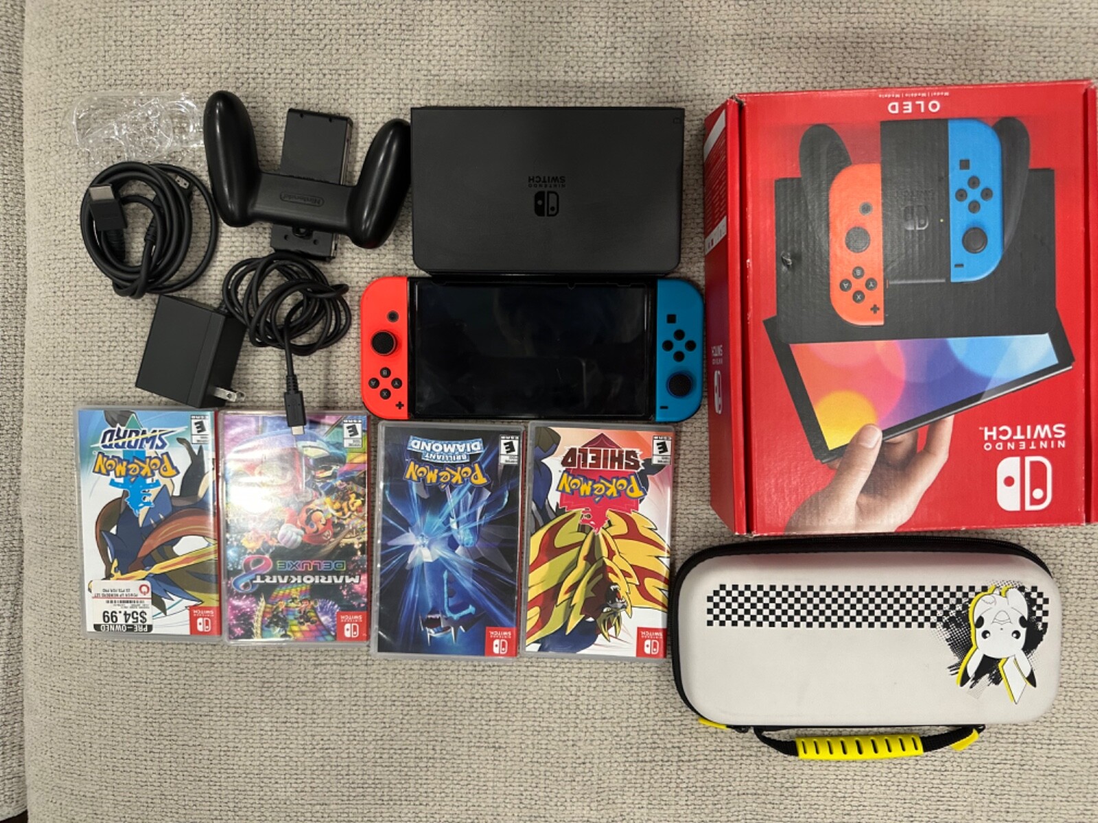 Barley used Nintendo Switch OLED Model-64GB Red/Blue with many games,accessories