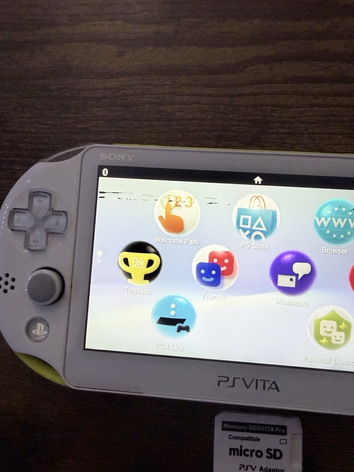 Sony PS Vita 2000 Handheld Console White/Yellow with Wi-Fi micro SD Adapter