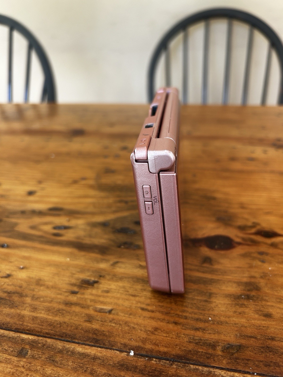Nintendo DSi XL Metallic Rose Handheld System (No charger, pen or accessories)