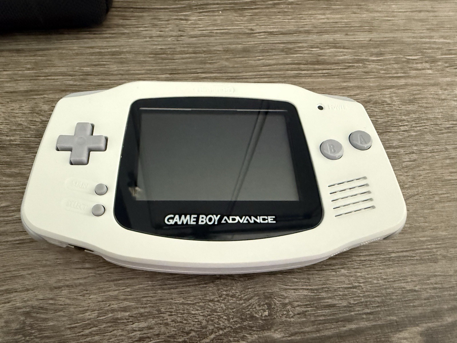 Near Mint Game boy Advance Arctic White + Case + unopened acrylic display stand