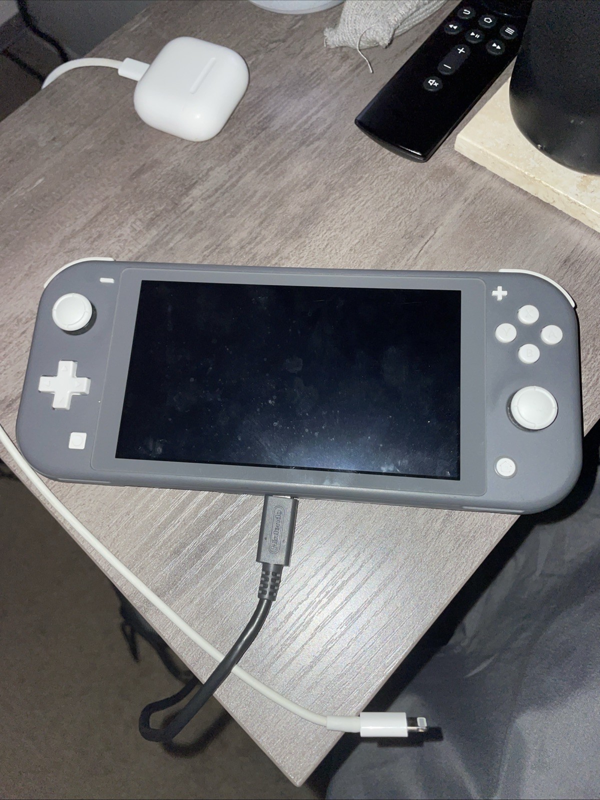 Nintendo Switch Lite.includes charger case and super Mario odyssey, couldadd2k18