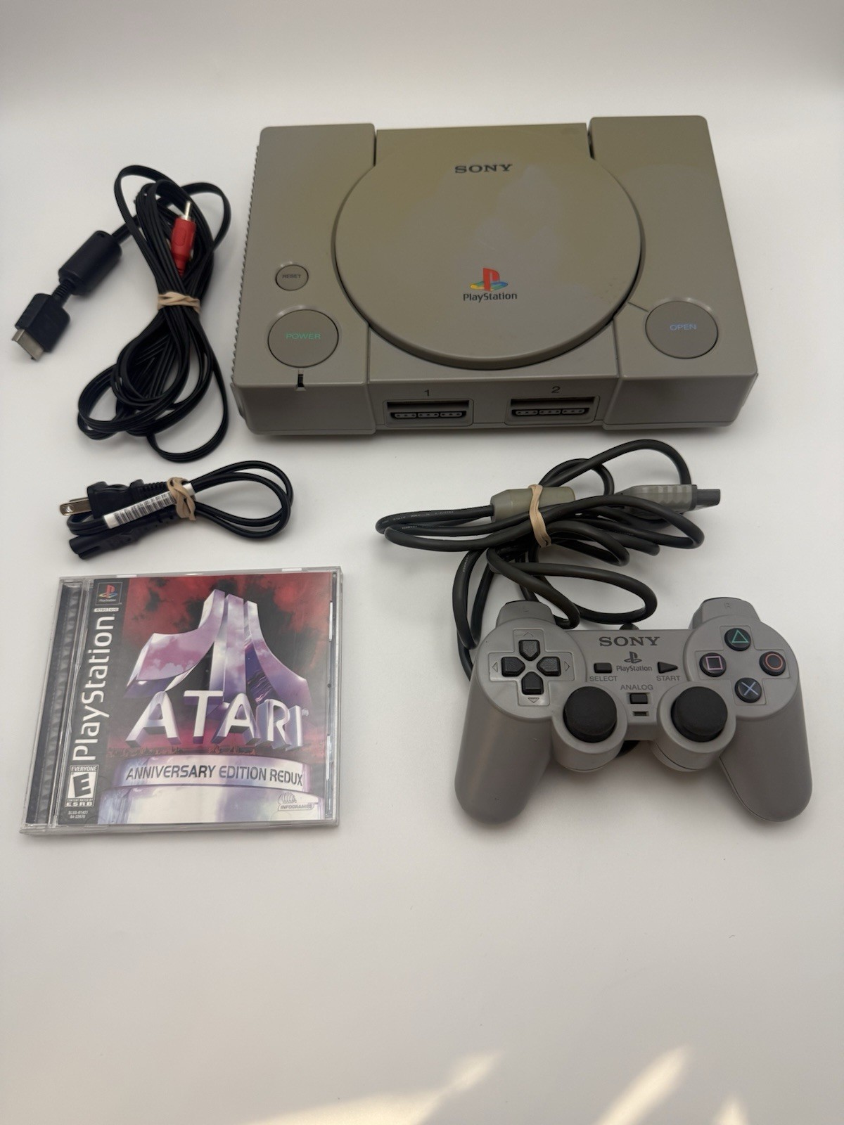 Sony PlayStation 1 PS1 Console Bundle with Oem DualShock Controller, And Game