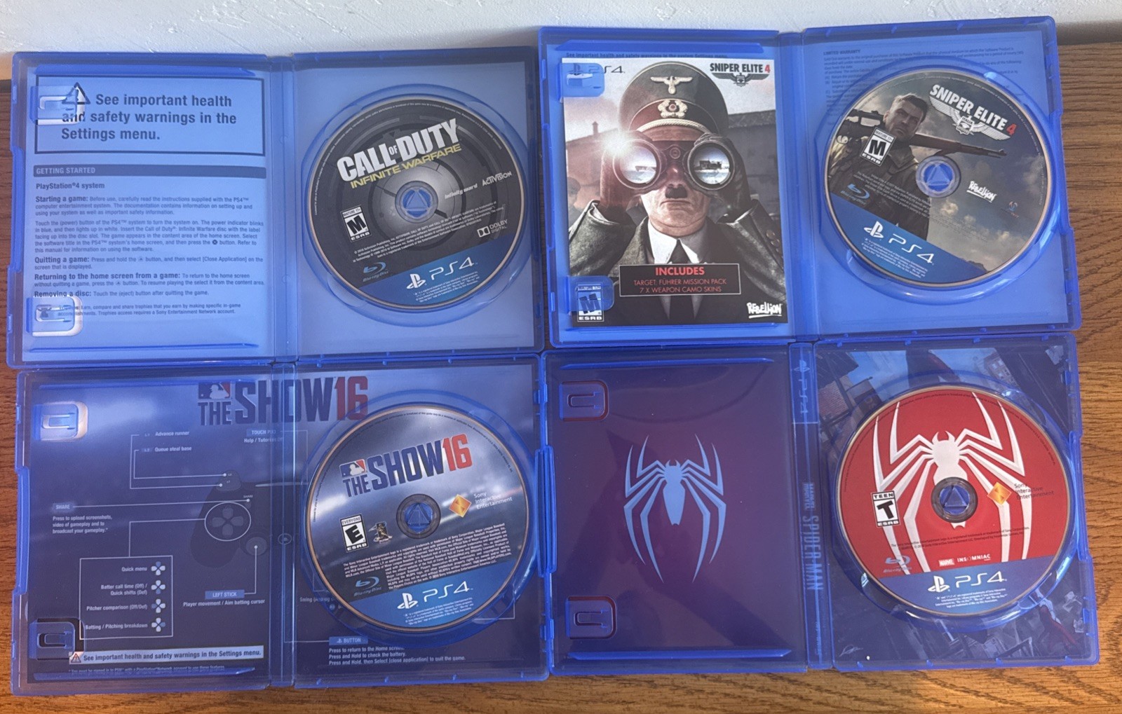 Sony PlayStation 4 Slim 1TB Black Console Bundle 16 Games 2 Remotes Cords Reset