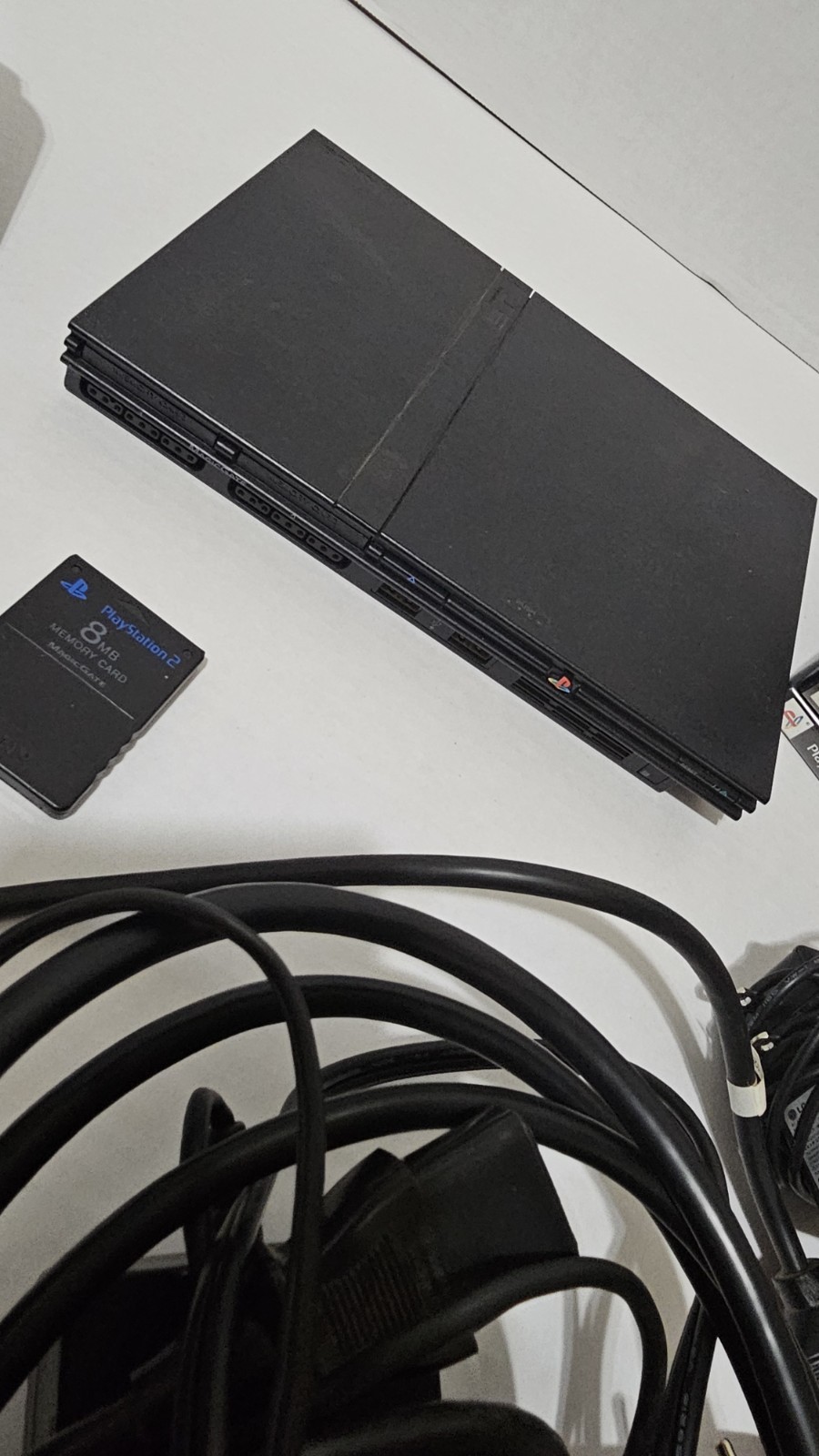 PlayStation 2 Slim with 4Controllers – Cords 8gb Memory Card And 11 Games.