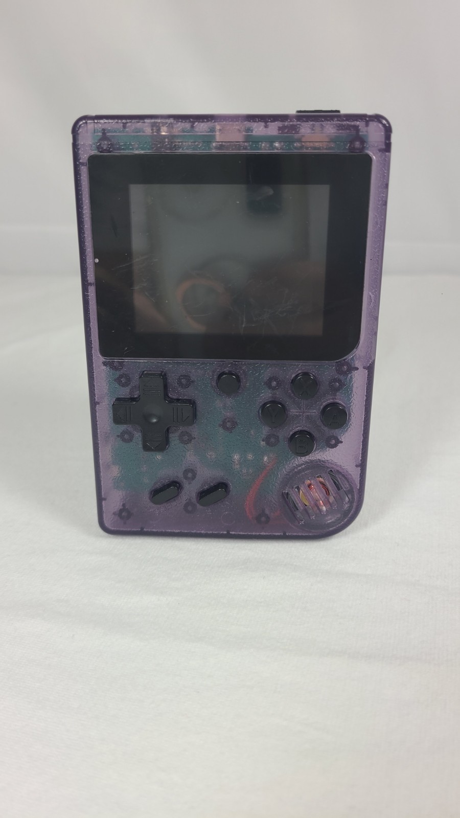 Merkury Innovations Arcade Fun Portable Game Console in a transparent purple…