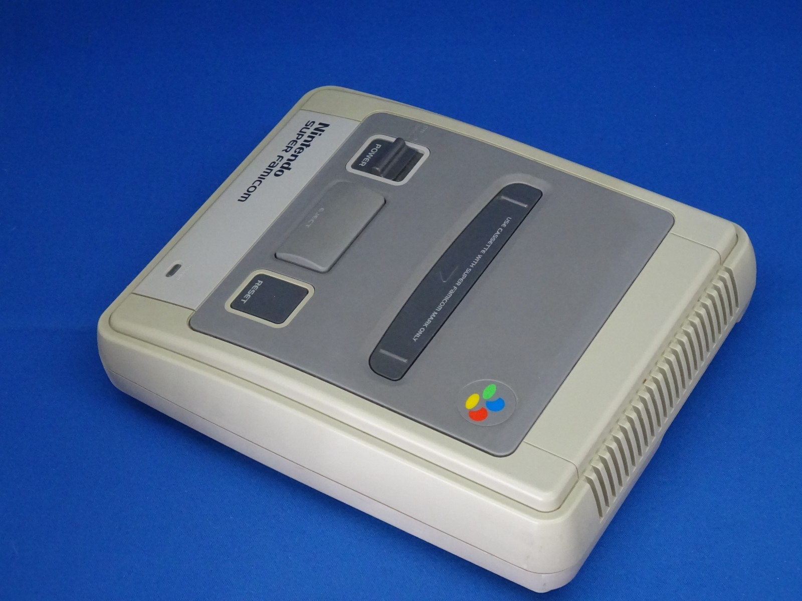 SNES case for Super Mario Kart, Super Mario World, and Super Picross.SNES shelf