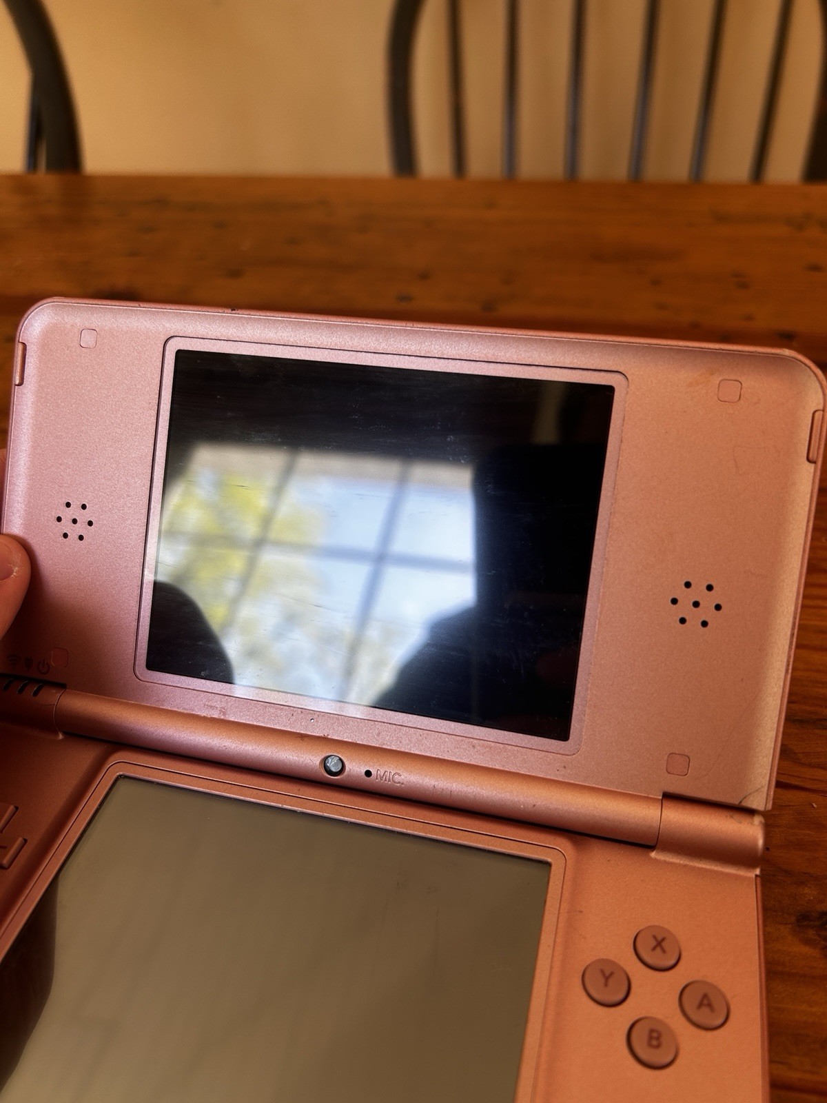 Nintendo DSi XL Metallic Rose Handheld System (No charger, pen or accessories)