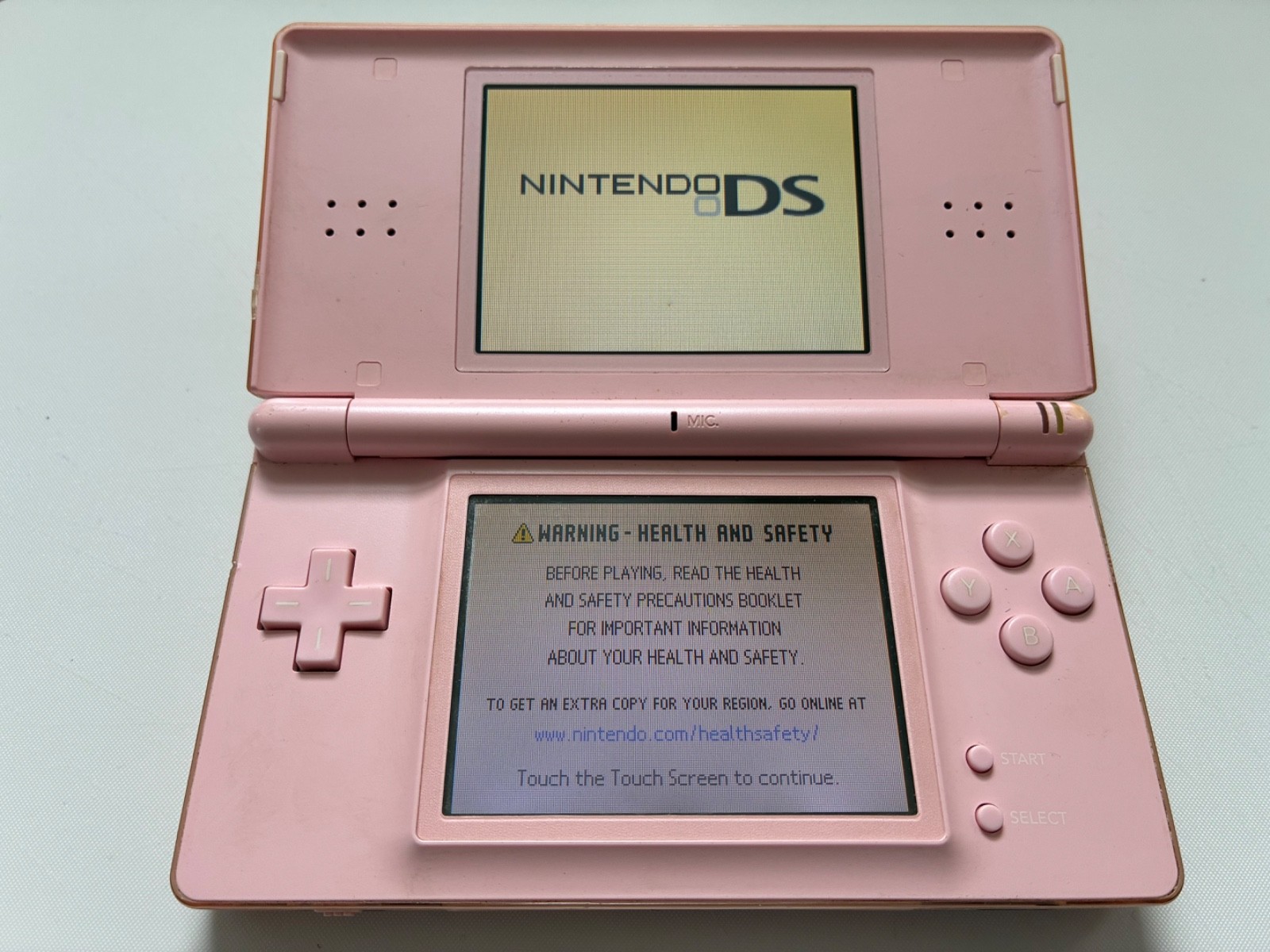 Nintendo DS Lite Handheld Console with Stylus and GBA Cover. Works, Cracks- Pink